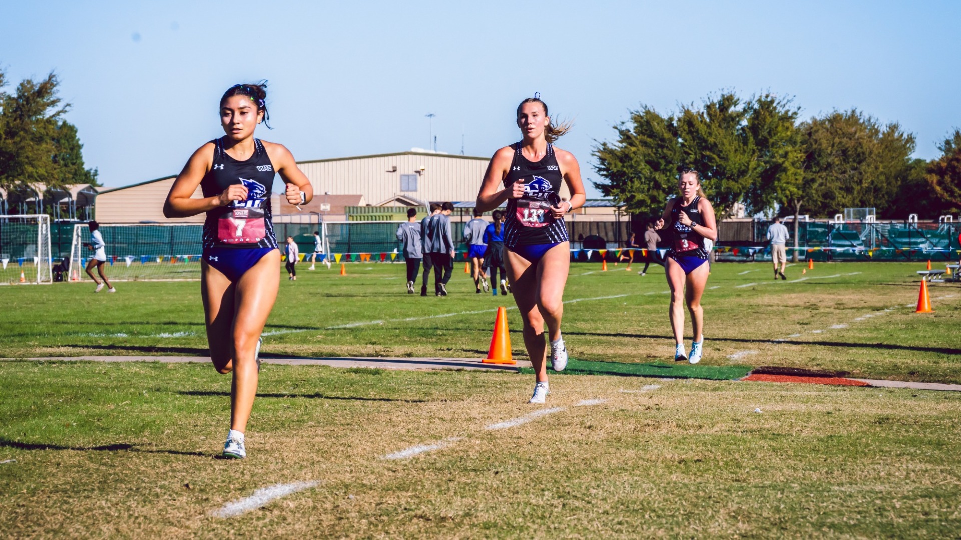 ACU's Alyssa Quinones, Madison Anderson, and Kyla Fuller run in the 2025 WAC Cross Country Championships