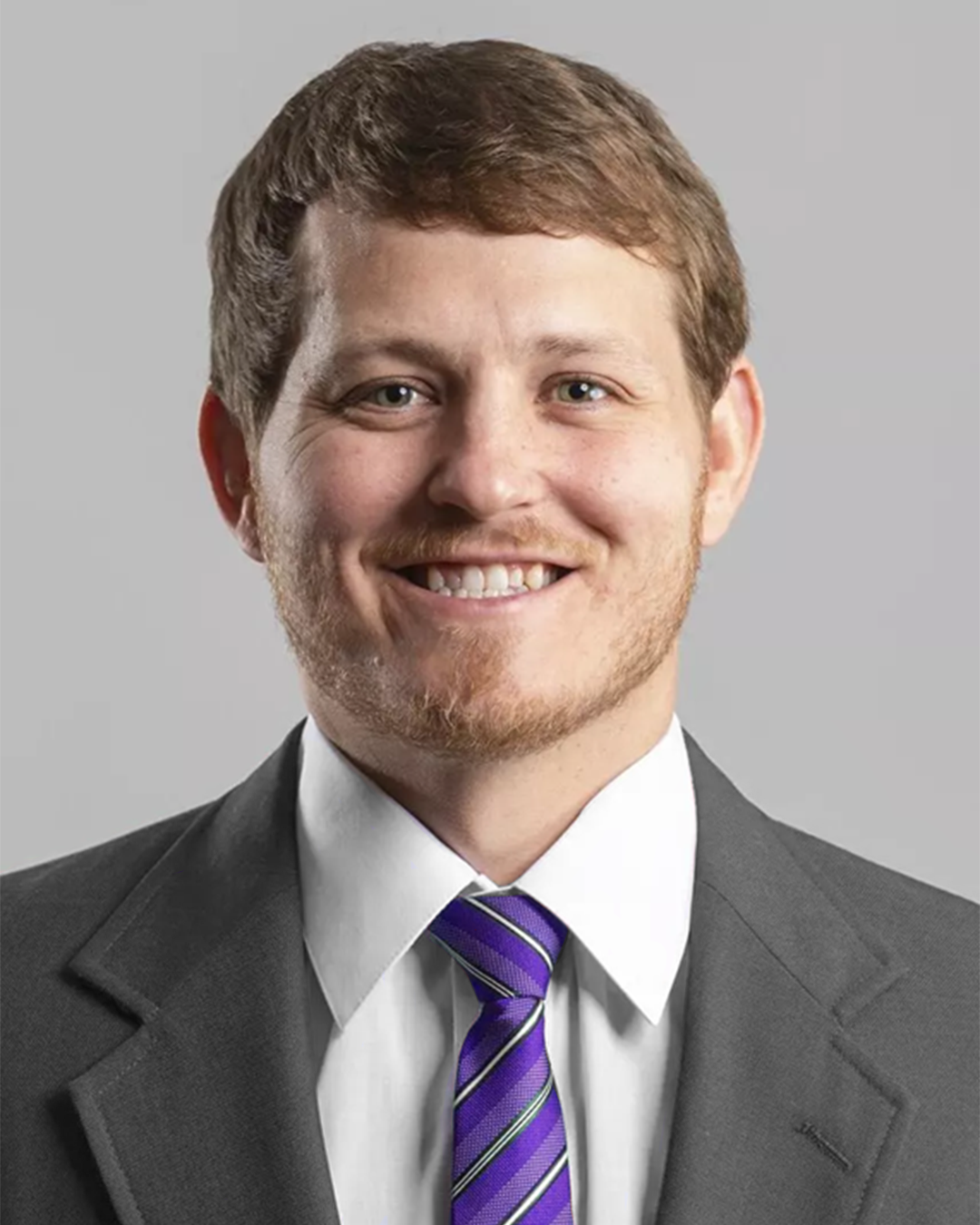 Stanton Keane purple tie headshot 2025