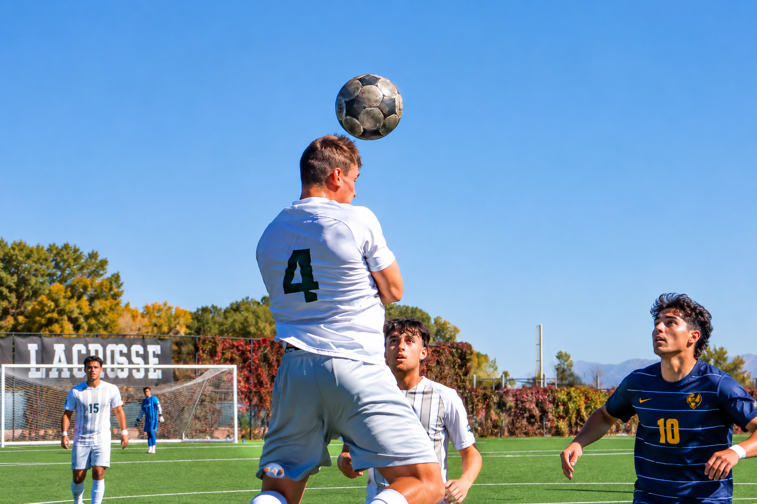 Adams State men soccer player #4 Anthony Benallo heads a ball against Westminster on October 4, 2026
