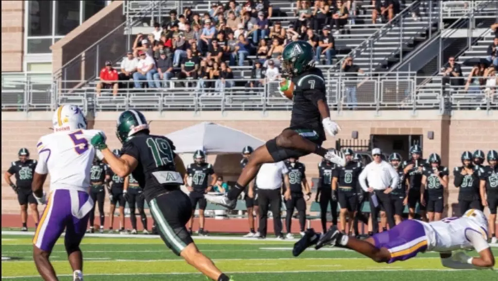 Adams State #7 Andre Branch leaps over Western New Mexico defender in their matchup August 27, 2026 