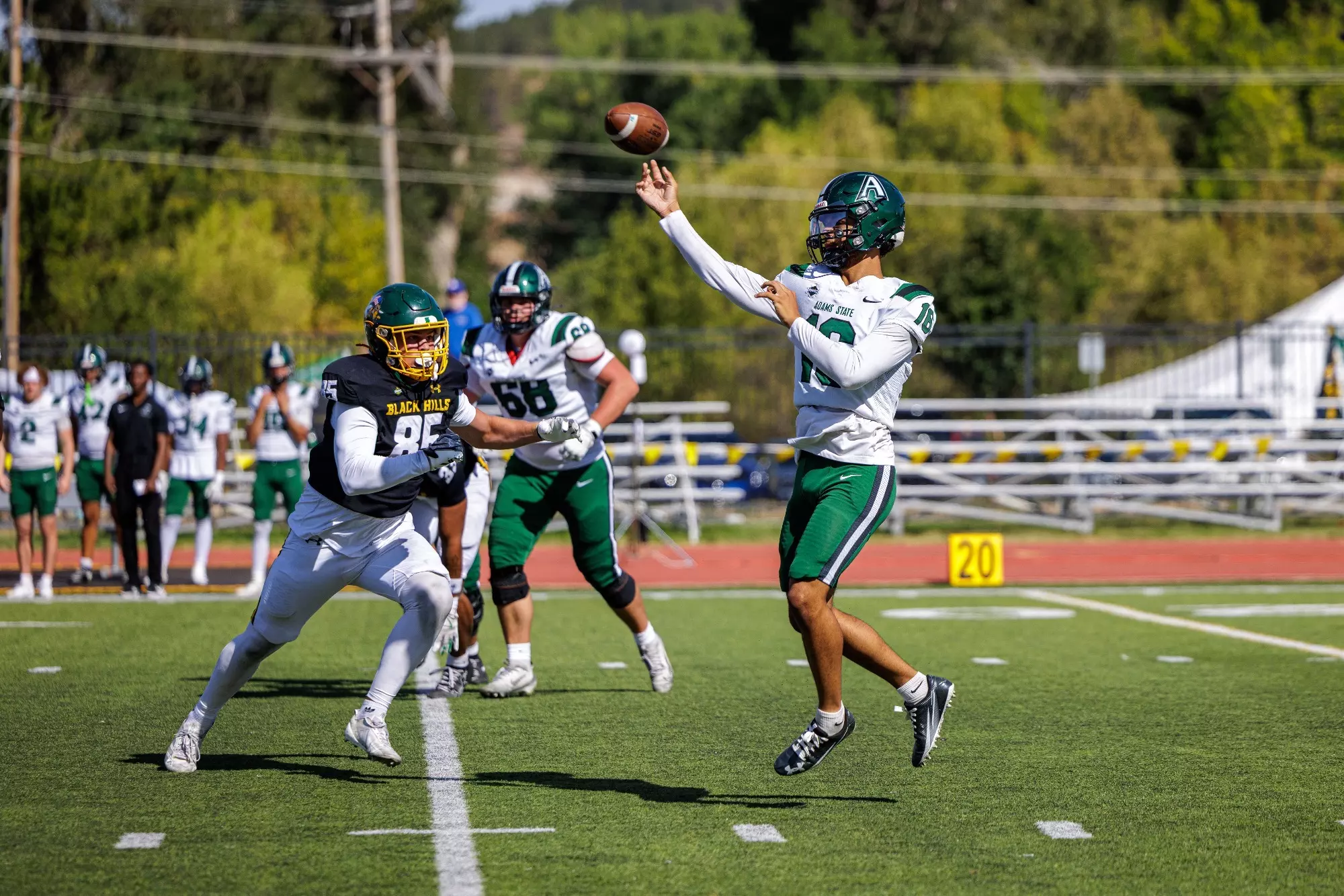 #10 Jett Lewis of the Grizzlies reels back to make a pass against Black Hills State University University in their loss on September 12, 2026