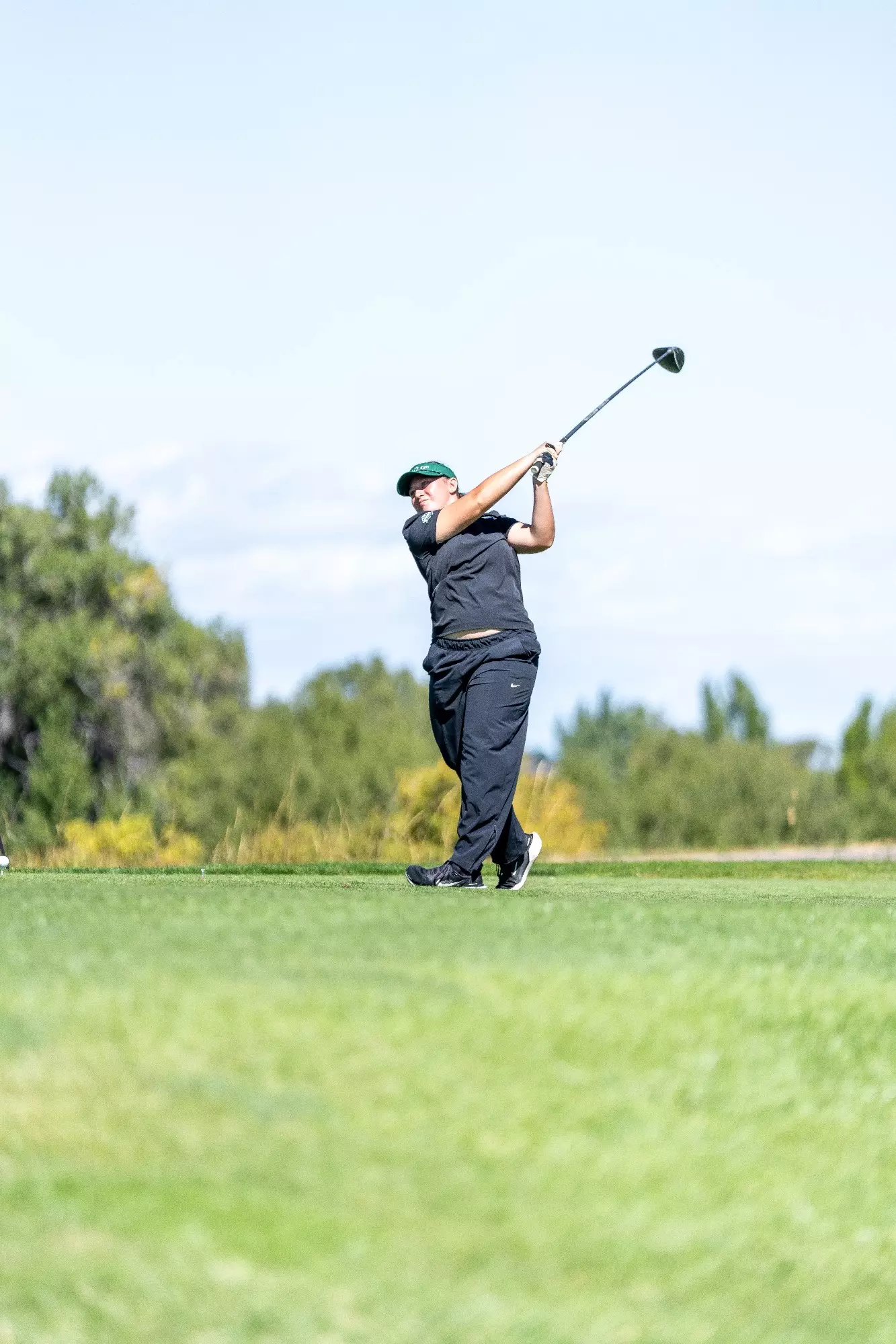 A golfer swings club in the Travis memorial invitation on September 14, 2026
