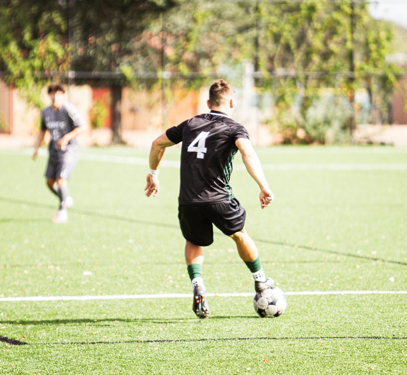 #4 Anthony Benallo getting ready to kick the ball across the field