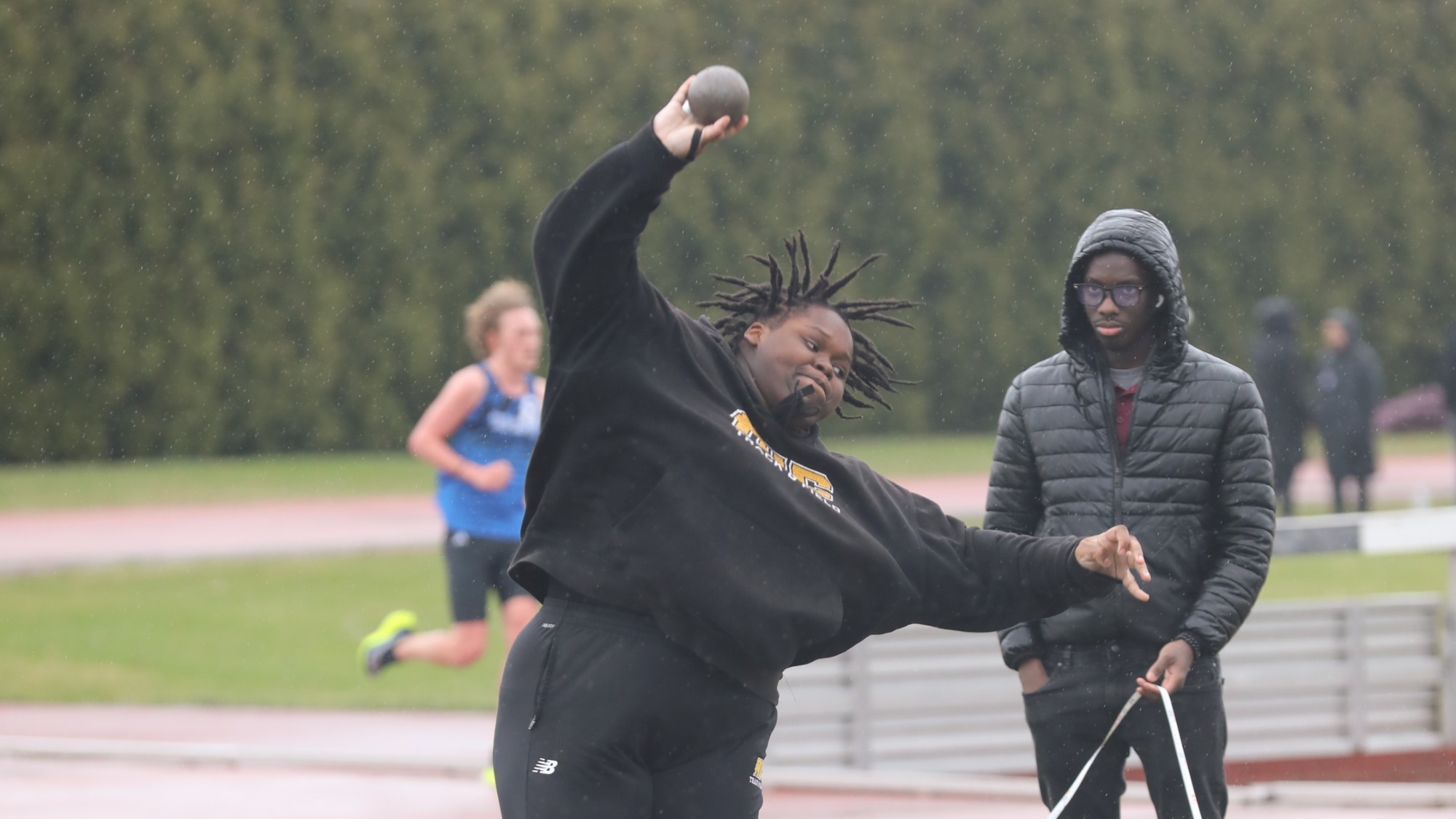 Thunder Mayhew throws the shot put at Springfield