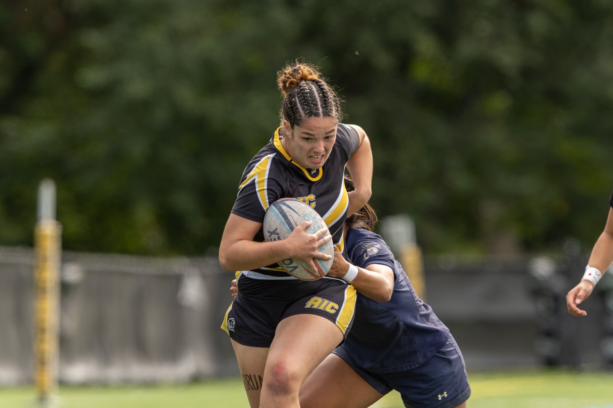Queri Beuter breaks a tackle against Navy