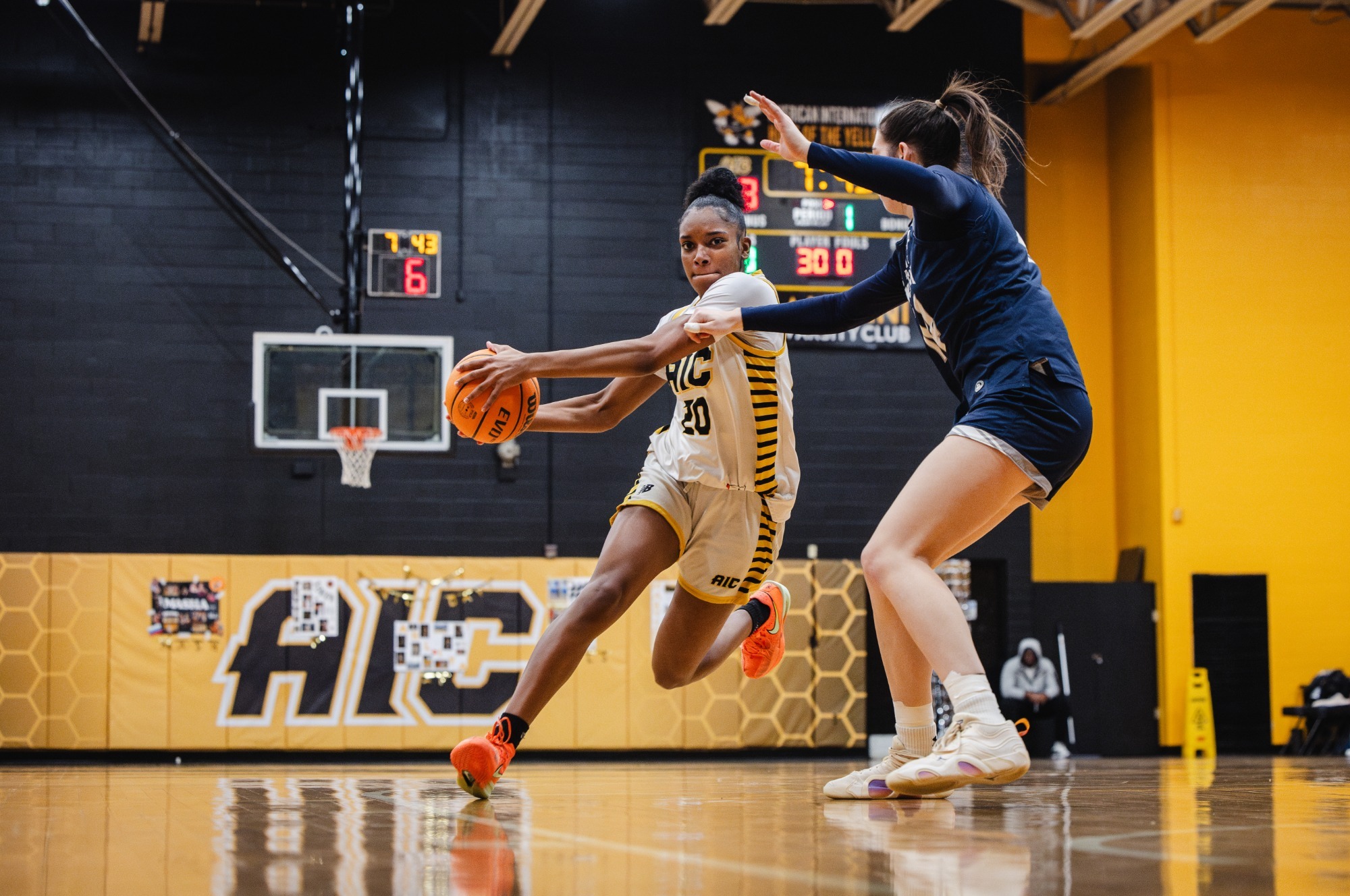 Keyvanna Bennett takes the ball to the hoop against Saint Anselm