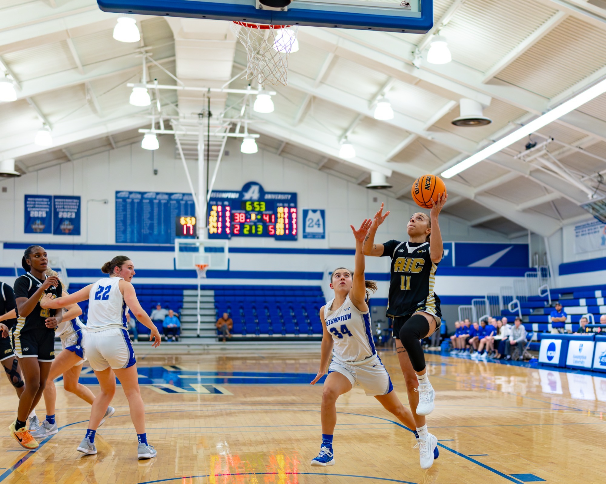 Ahliya Phillips goes to the hoop at Assumption