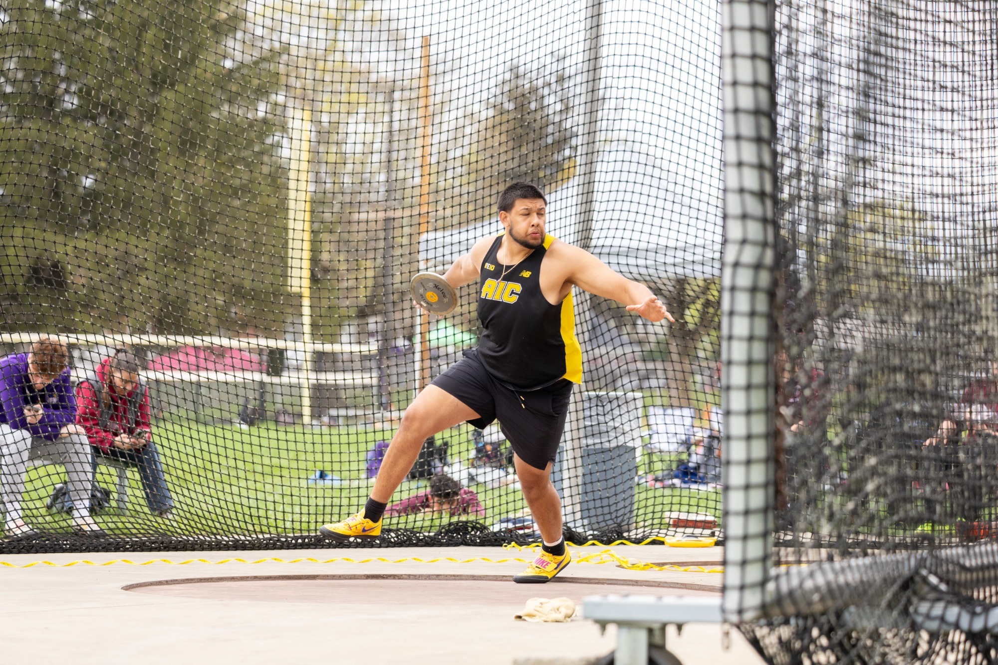 An AIC Discus thrower competes at the 2026 A Day meet