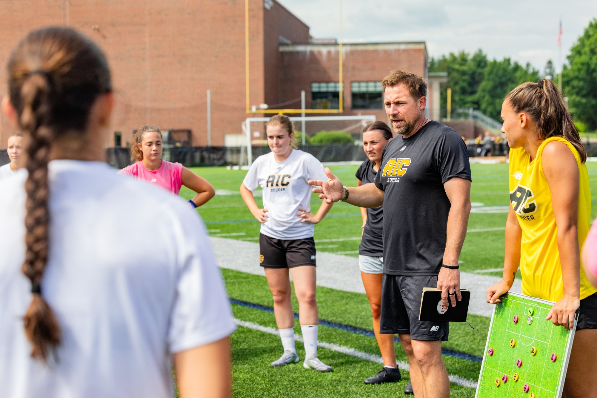 Sam Mitchell at practice with women's soccer
