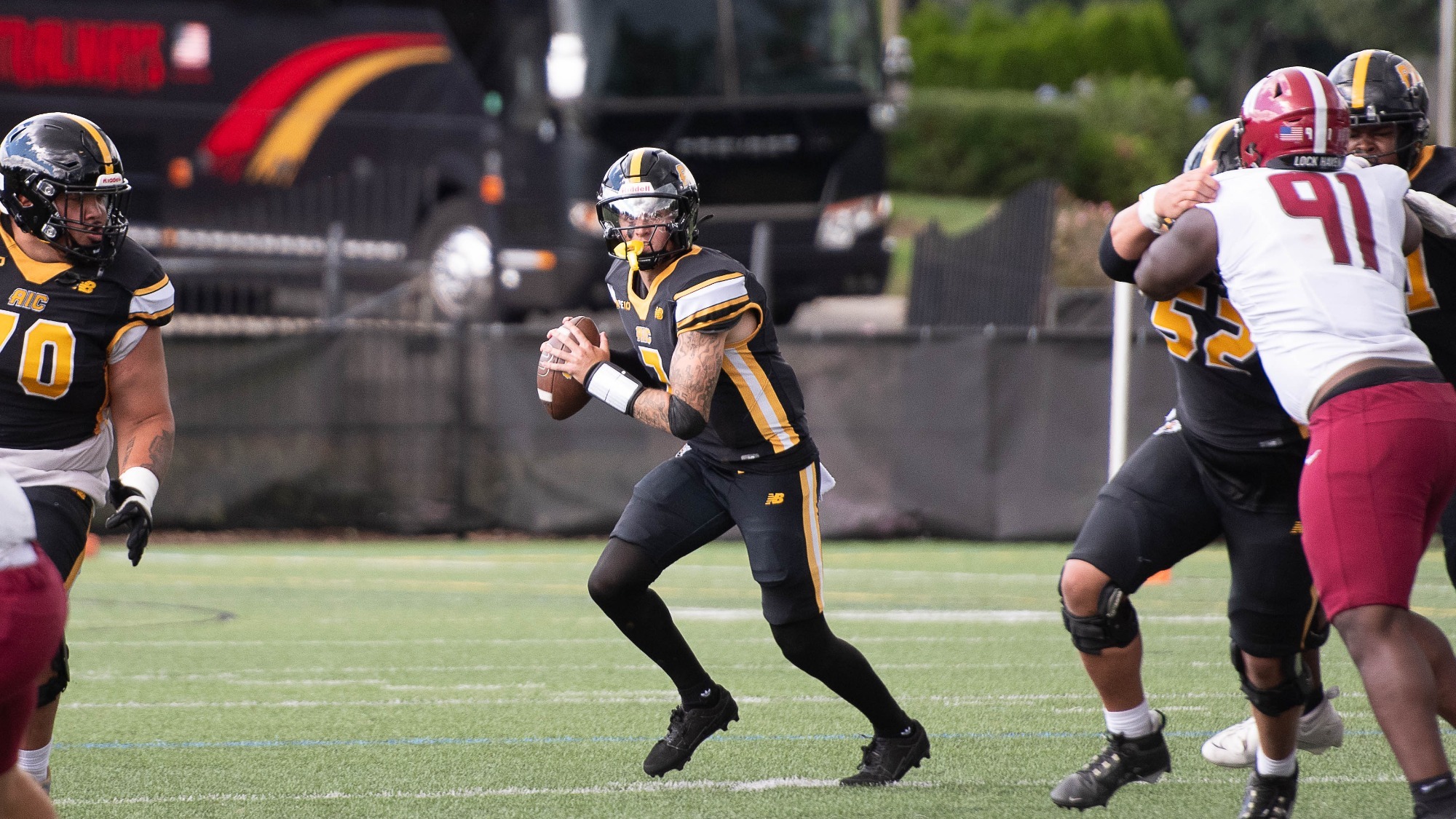 Bryden drops back to pass against Lock Haven