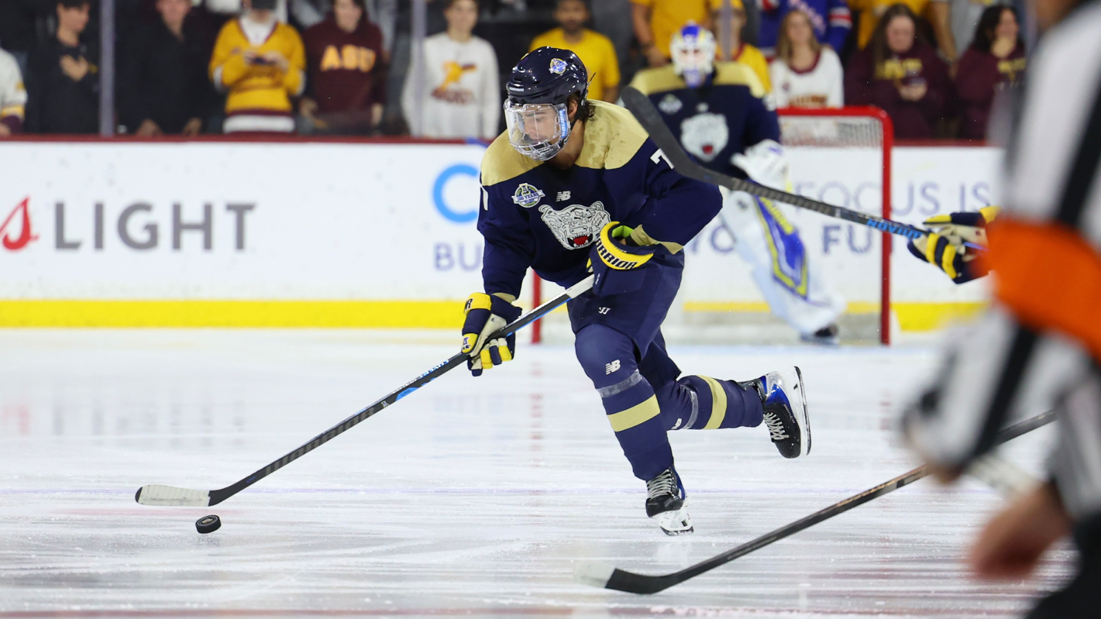 Jackson Anderson handles the puck against ASU at the Icebreaker Tournament
