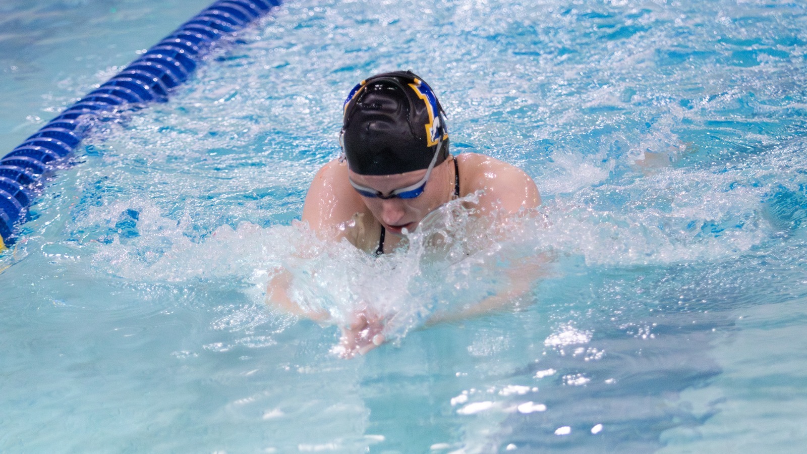 Cosima Schmiedel swims in the breaststroke during the Blue/Gold meet, 2025-26