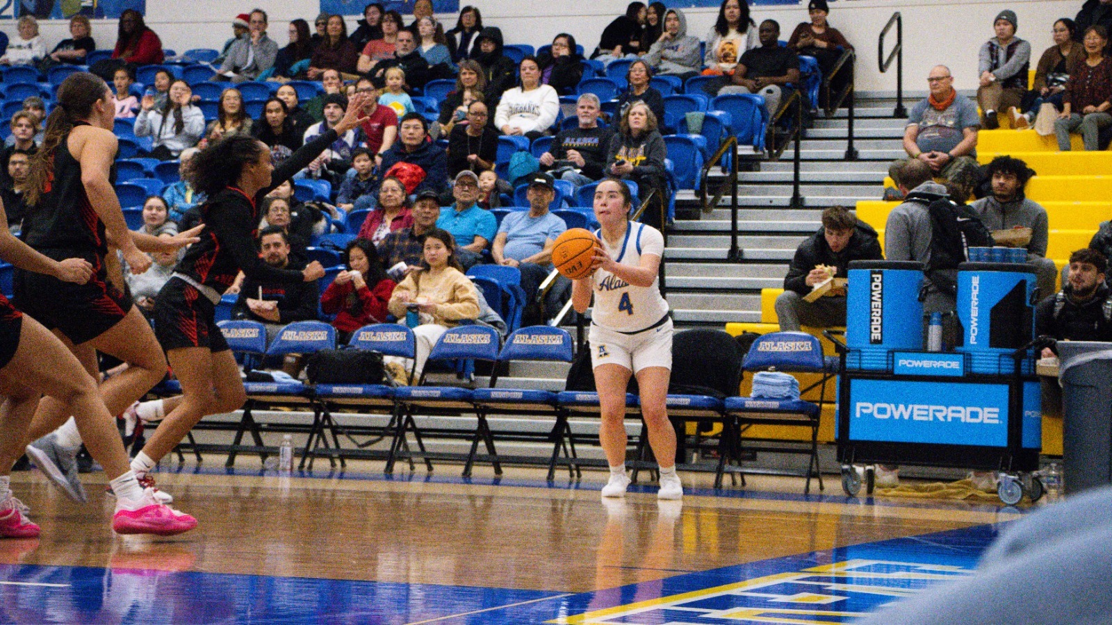 Emily Freeman shoots a corner three vs. Western Oregon in 2024-25