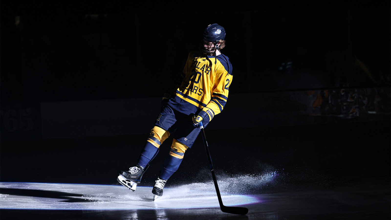 Cade Ahrenholz skates to the blue line during the starting lineups