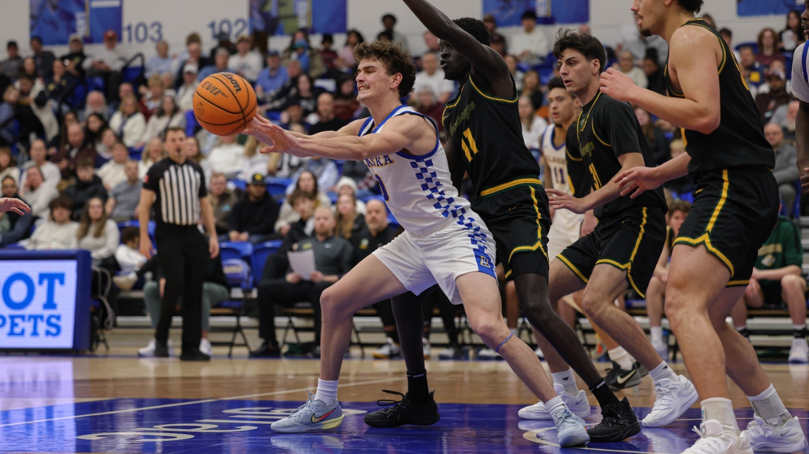 Tariq Weiser dishes a pass from the paint vs. Alaska Anchorage on Jan. 17, 2026