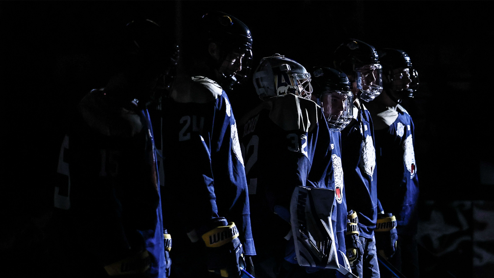 Nanooks line up on the blue line during starting lineups