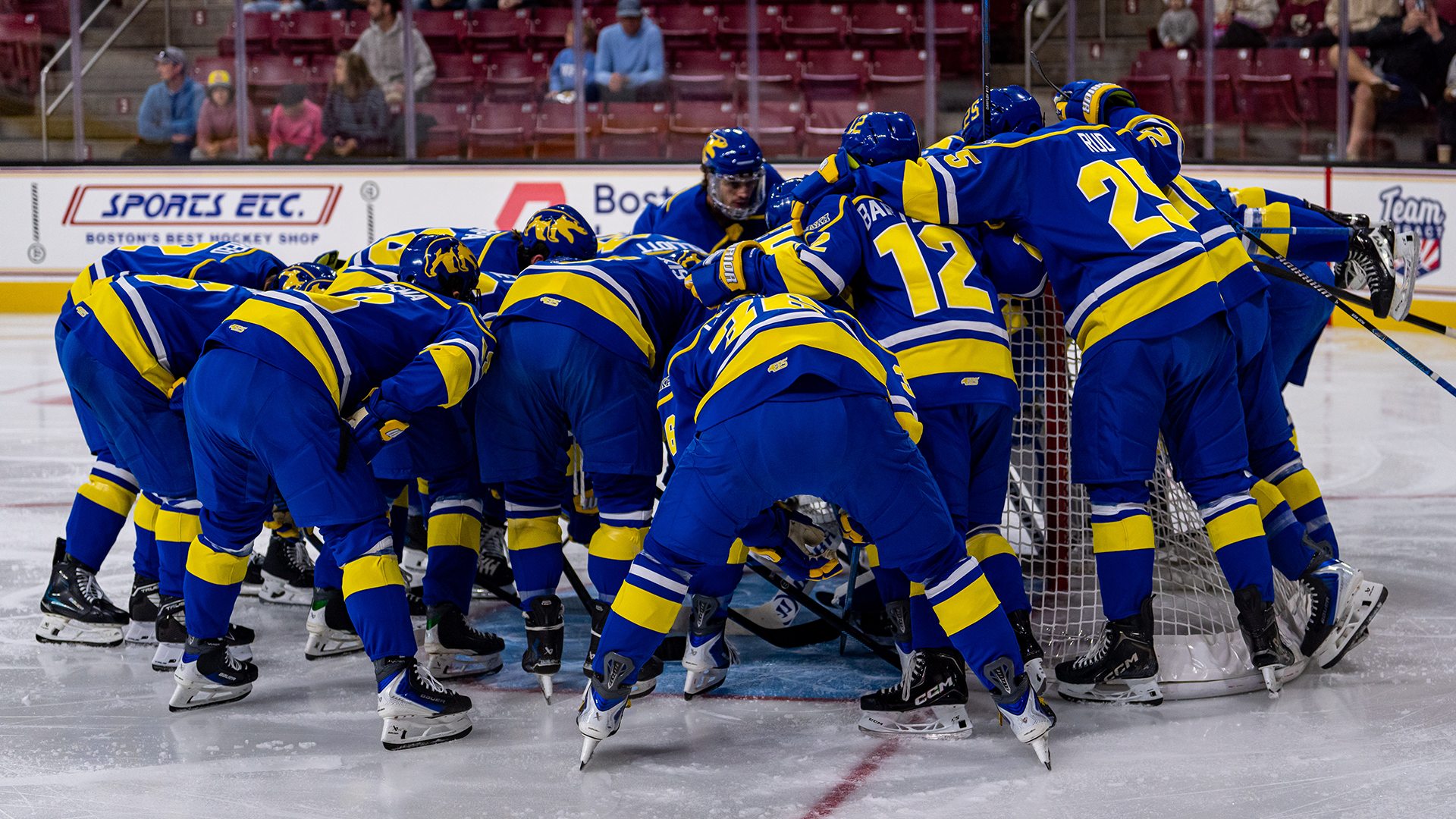 Team huddles around the net at Boston College