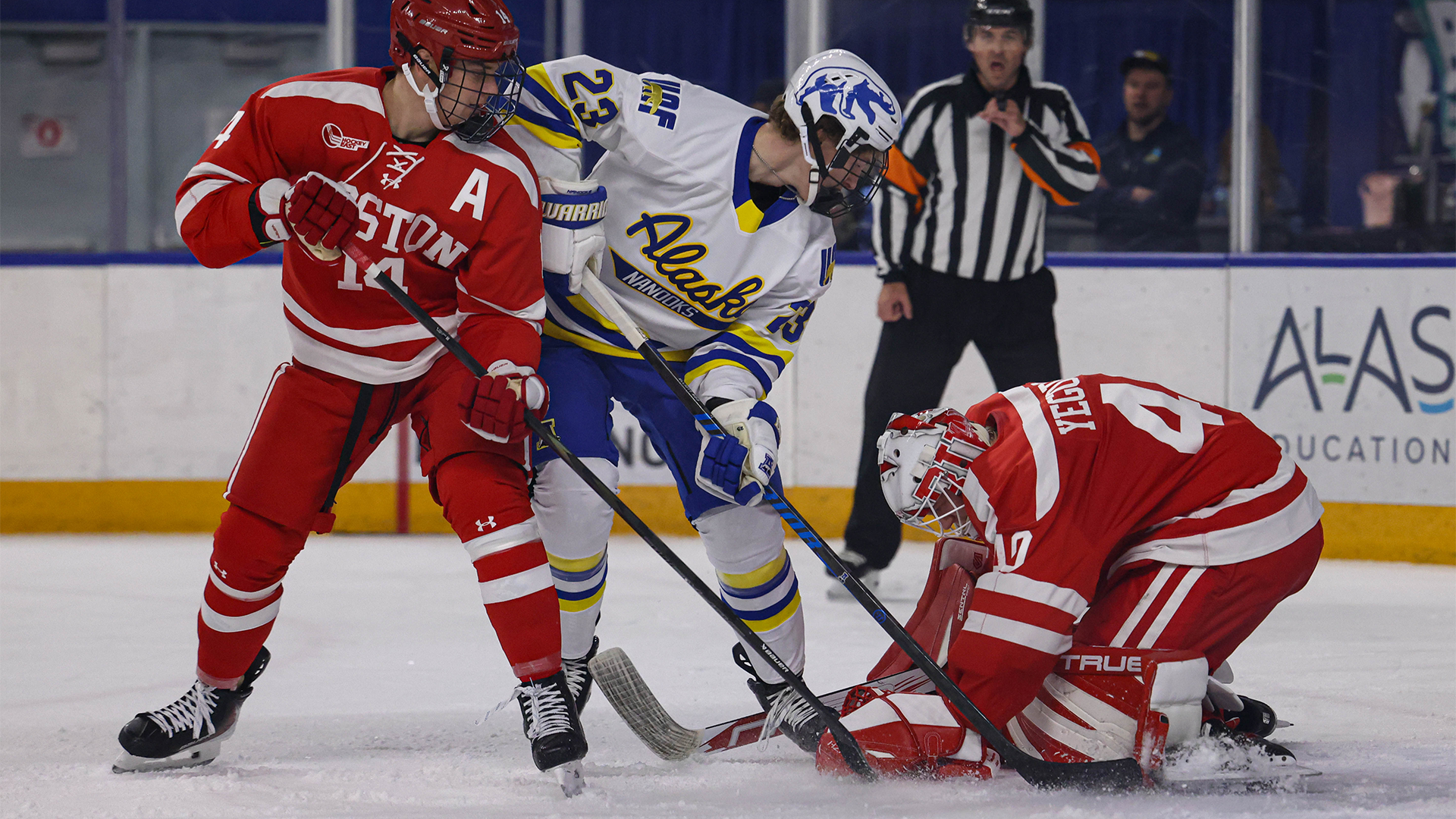 Sam Elliott in front of BU goalie