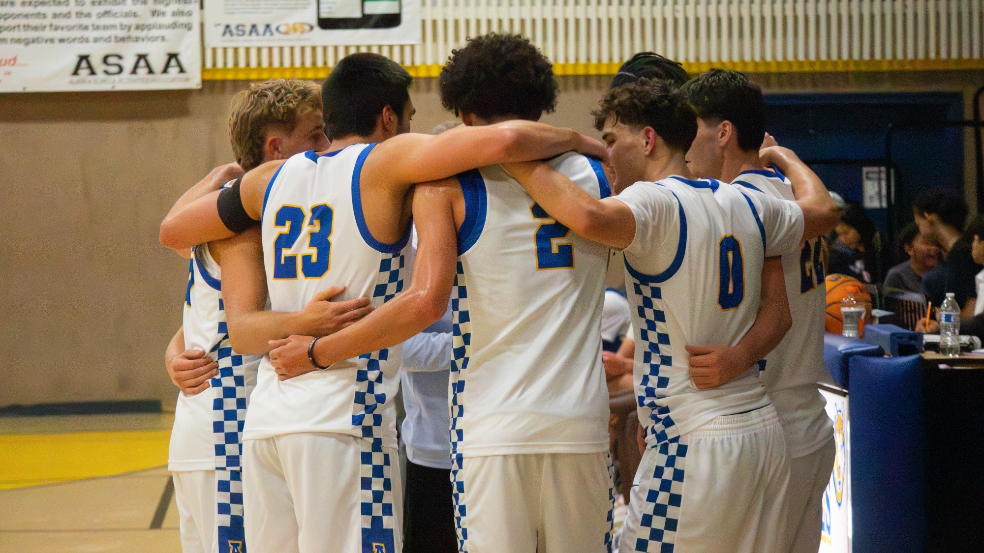 Nanooks men's basketball team huddles during their Blue/Gold game in Kotzebue, Oct. 2026