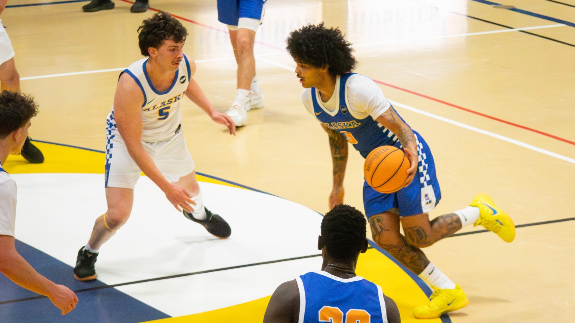 Tyriq Luke drives with the ball during Alaska's Blue/Gold Game, Oct. 17, 2026
