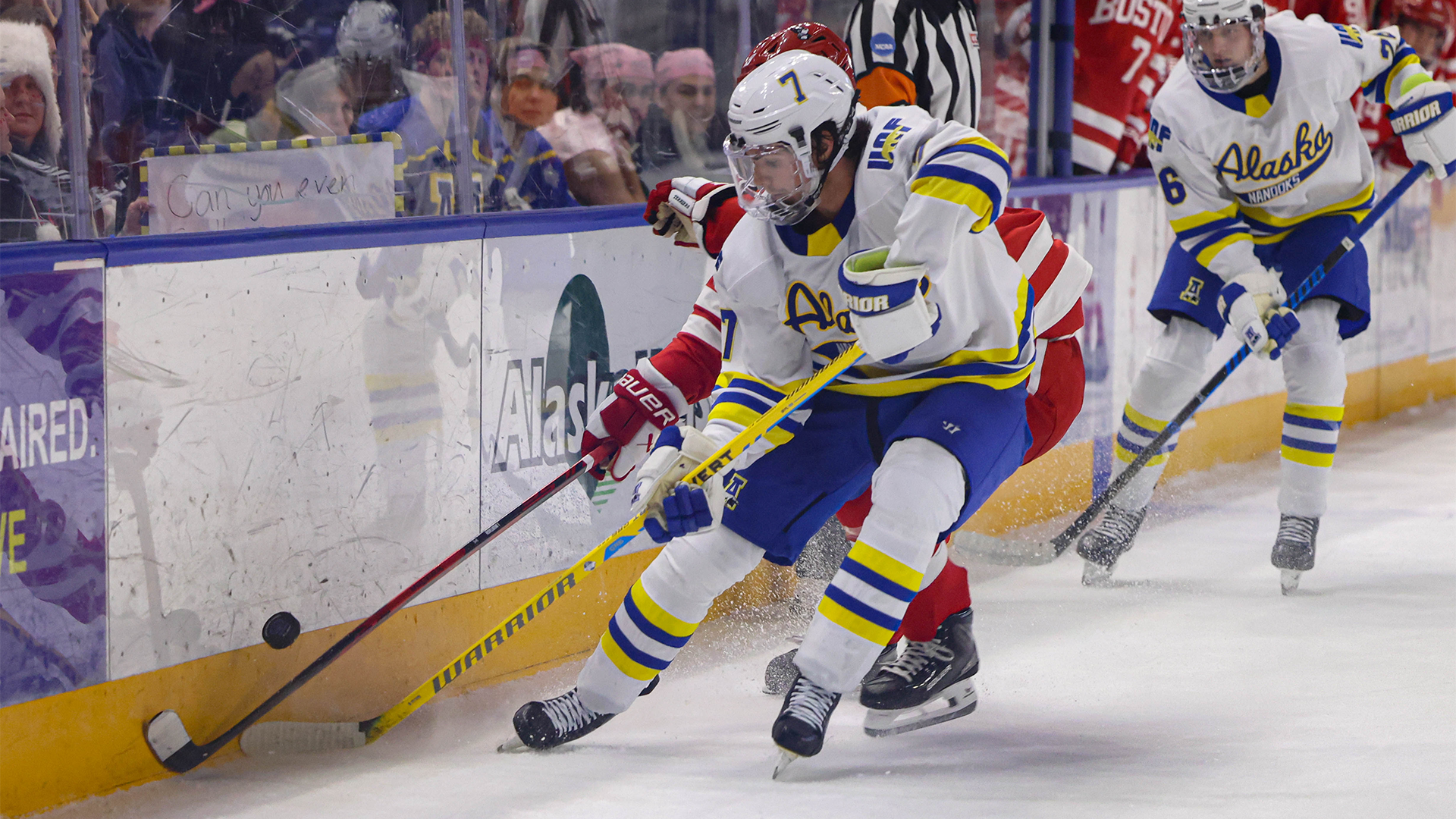 Jackson Anderson plays the puck near the half wall vs. Boston University