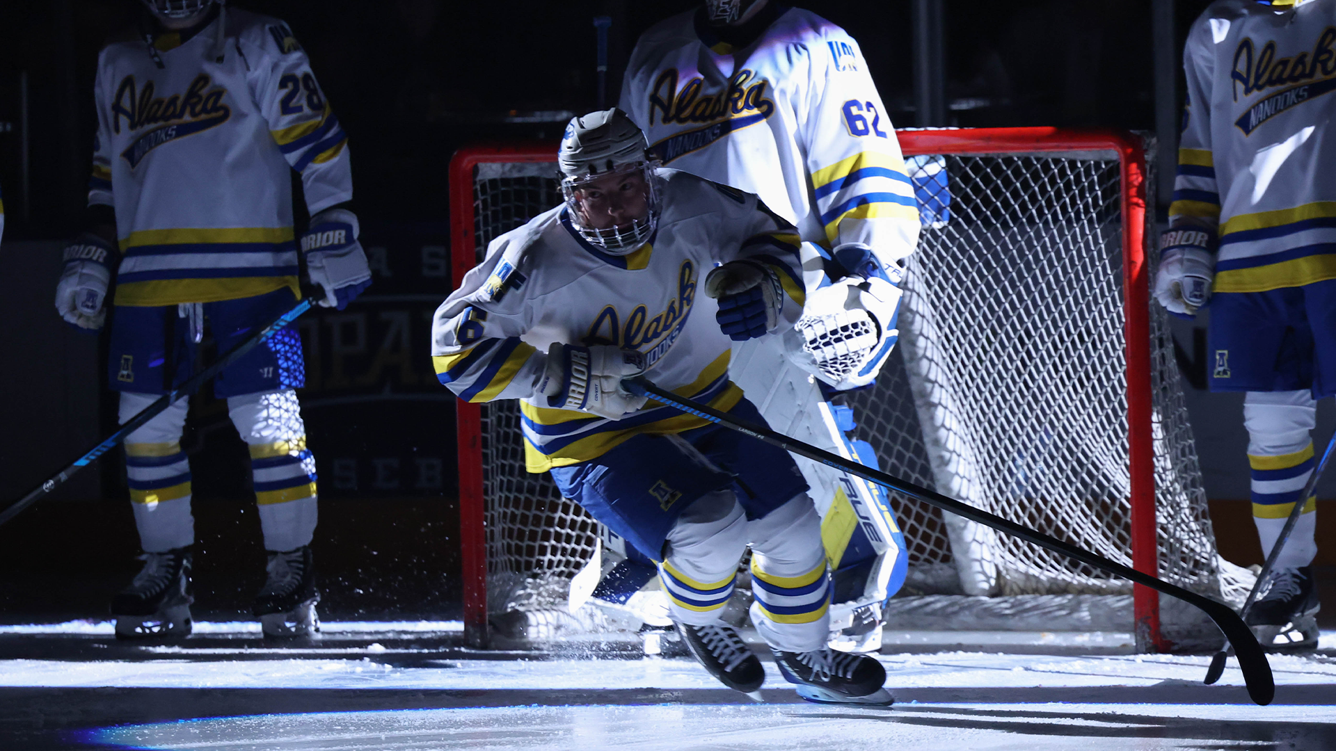 Jhett Larson skates to the blue line after being introduced as a starter vs. BU