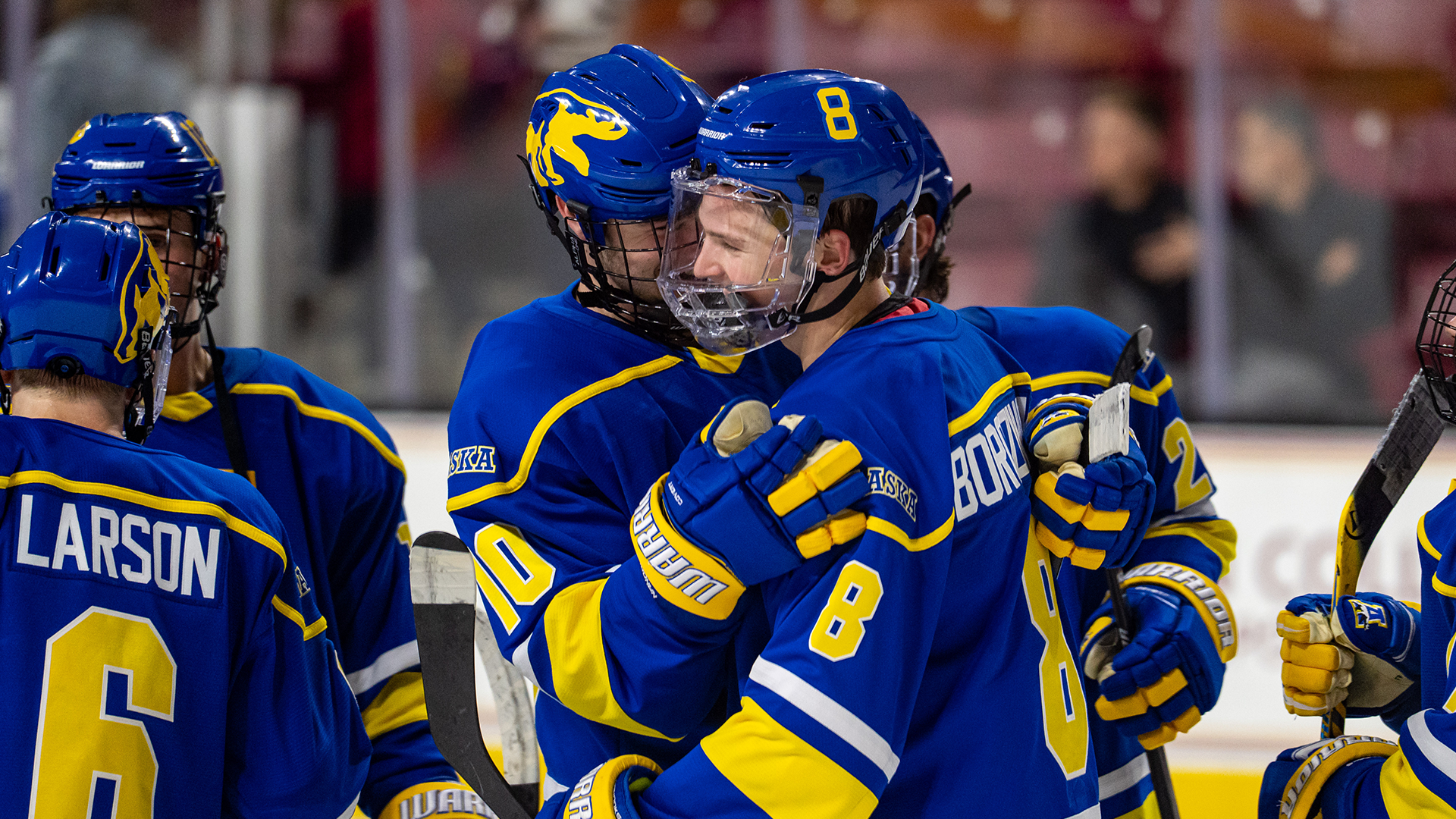Jack Rogers celebrates with Davis Borozinskis after a 3-2 win at No. 11 Boston College