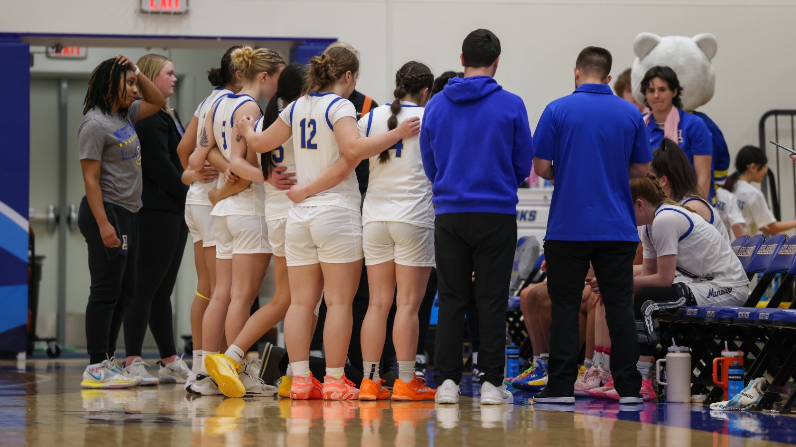 Nanooks huddle around the bench vs. Saint Martin's, Feb. 2026