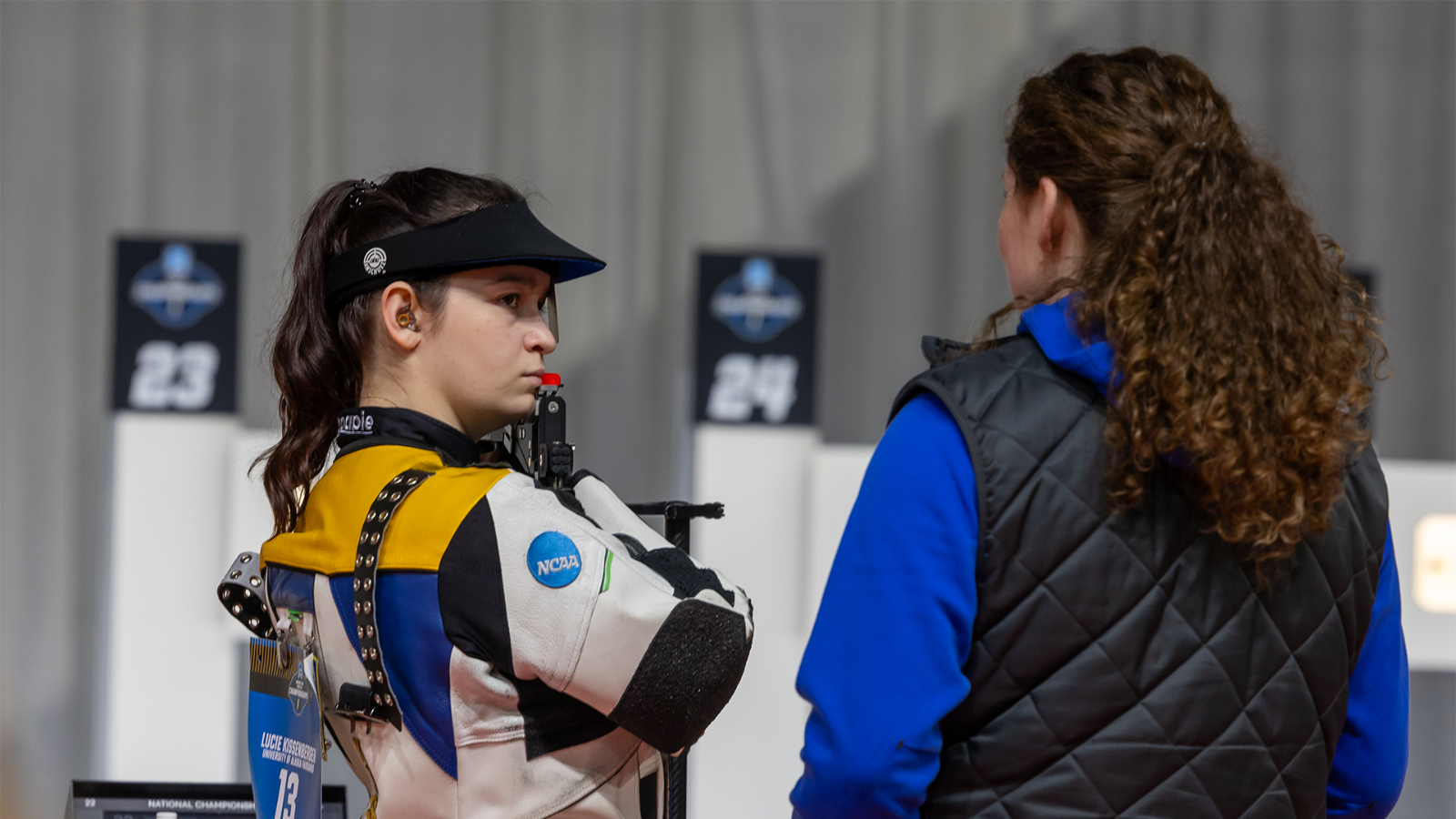 Lucie Kissenberger looks at Randi Loudin as she coaches her during practice at the NCAA Championships 2026