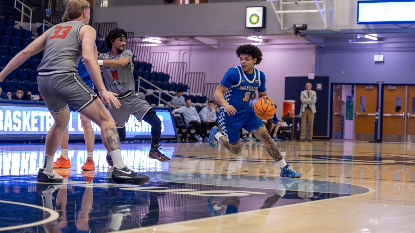 Tyriq Luke drives with the ball vs. Northwest Nazarene at the 2026 GNAC Men's Basketball Championships, March 5, 2026