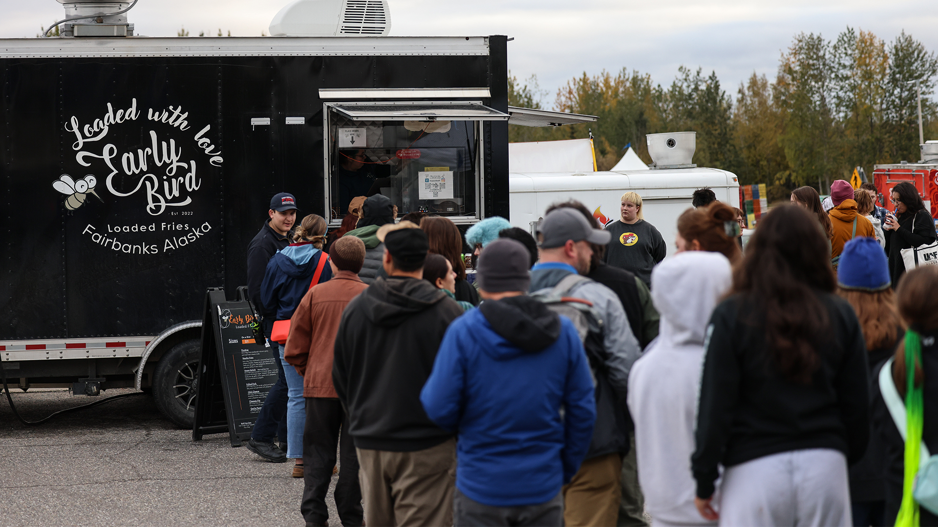 Fans line up at Early Bird Loaded Fries during the 2025 Food Truck Rally
