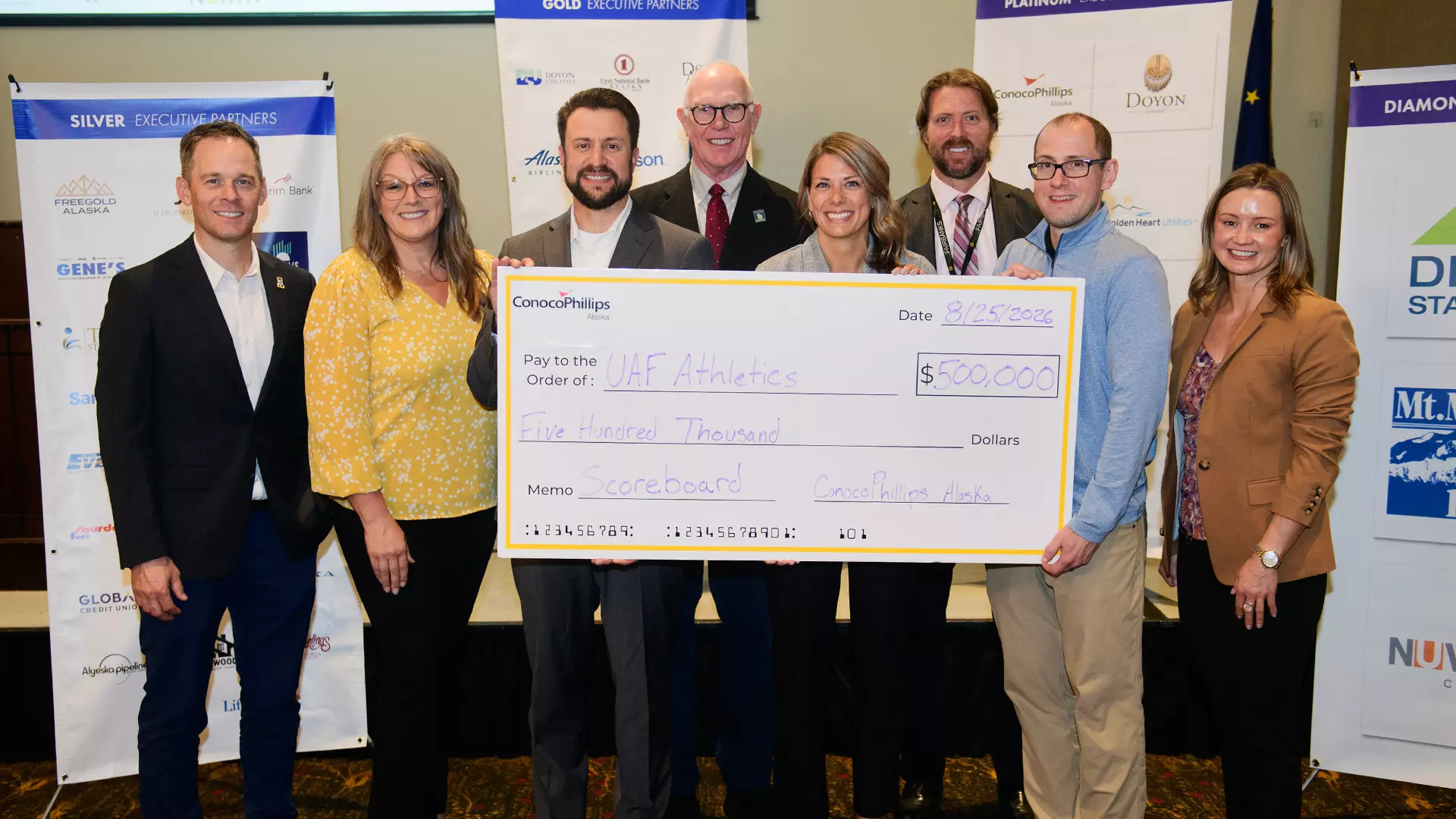 (L-R): Brock Anundson - Athletic Director, Marisa Sharrah - Associate AD for External Relations, Craig Plante - Production Delivery Manager, ConocoPhillips Alaska, Larry Hinzman - Interim Chancellor, Sarah Rogers - Advisor, Communications and Community Investment, ConocoPhillips Alaska, Chad Hutchison - Director of State Relations, University of Alaska, Caroline Schultz - Government Relations Director, ConocoPhillips Alaska