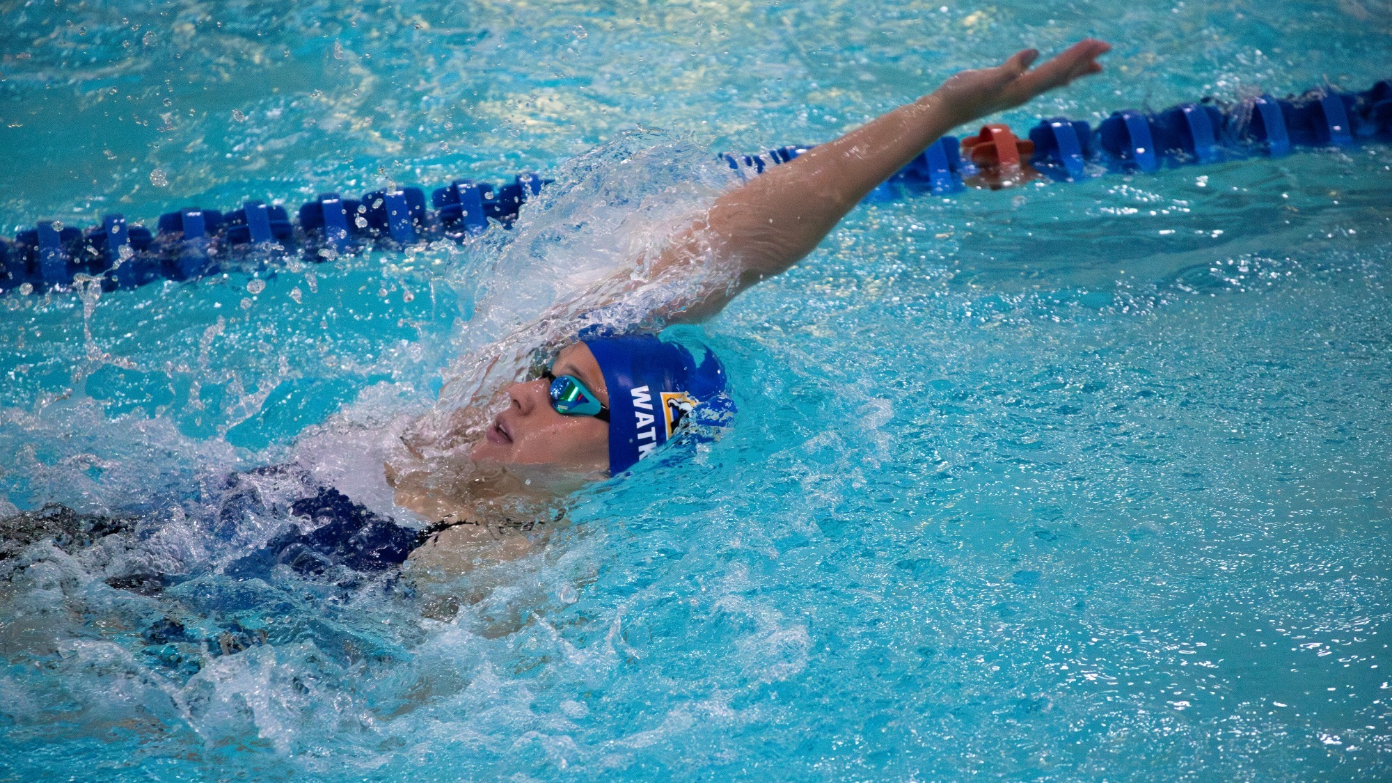 Charisma Watkins swims backstroke during a dual meet vs. Westmont, 2025-26