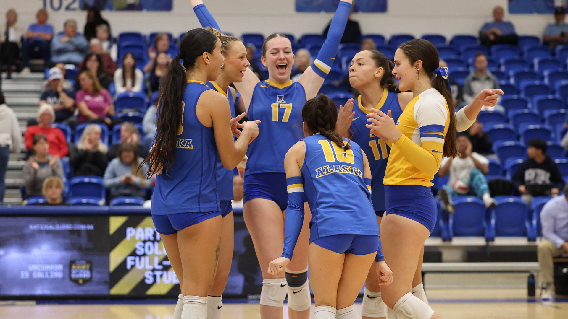 Nanooks celebrate a point on the court against WWU 9/26