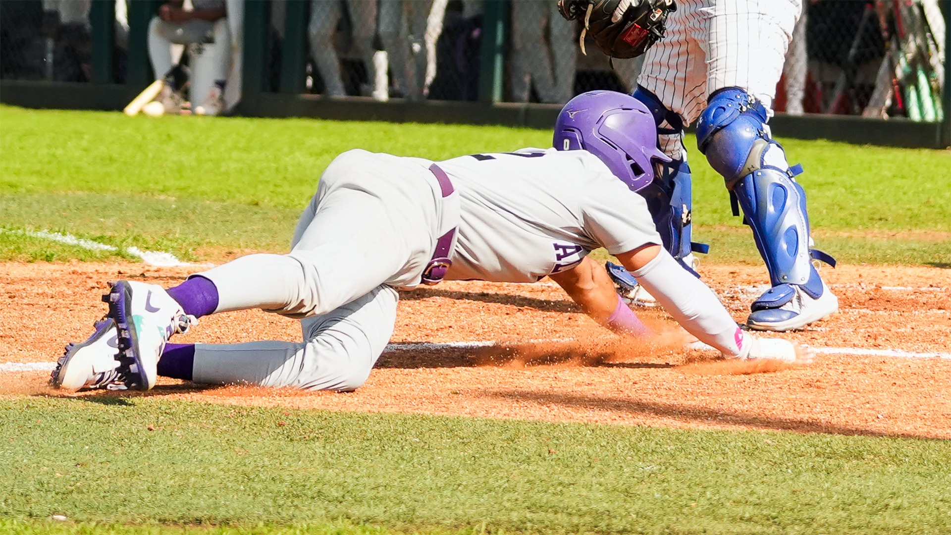 Baseball Player Sliding Back to First at Houston Christian