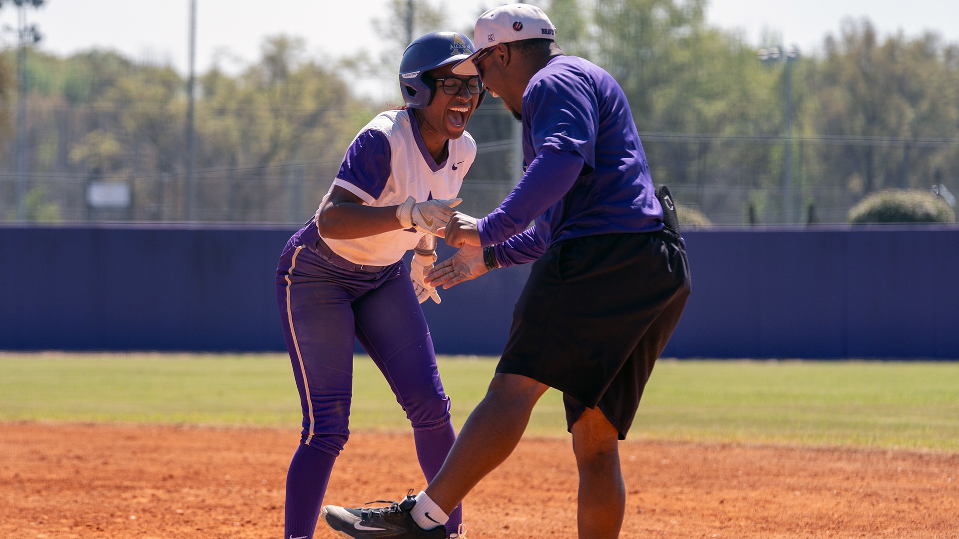 Thompson and Softball Player at First Celebration vs. PV
