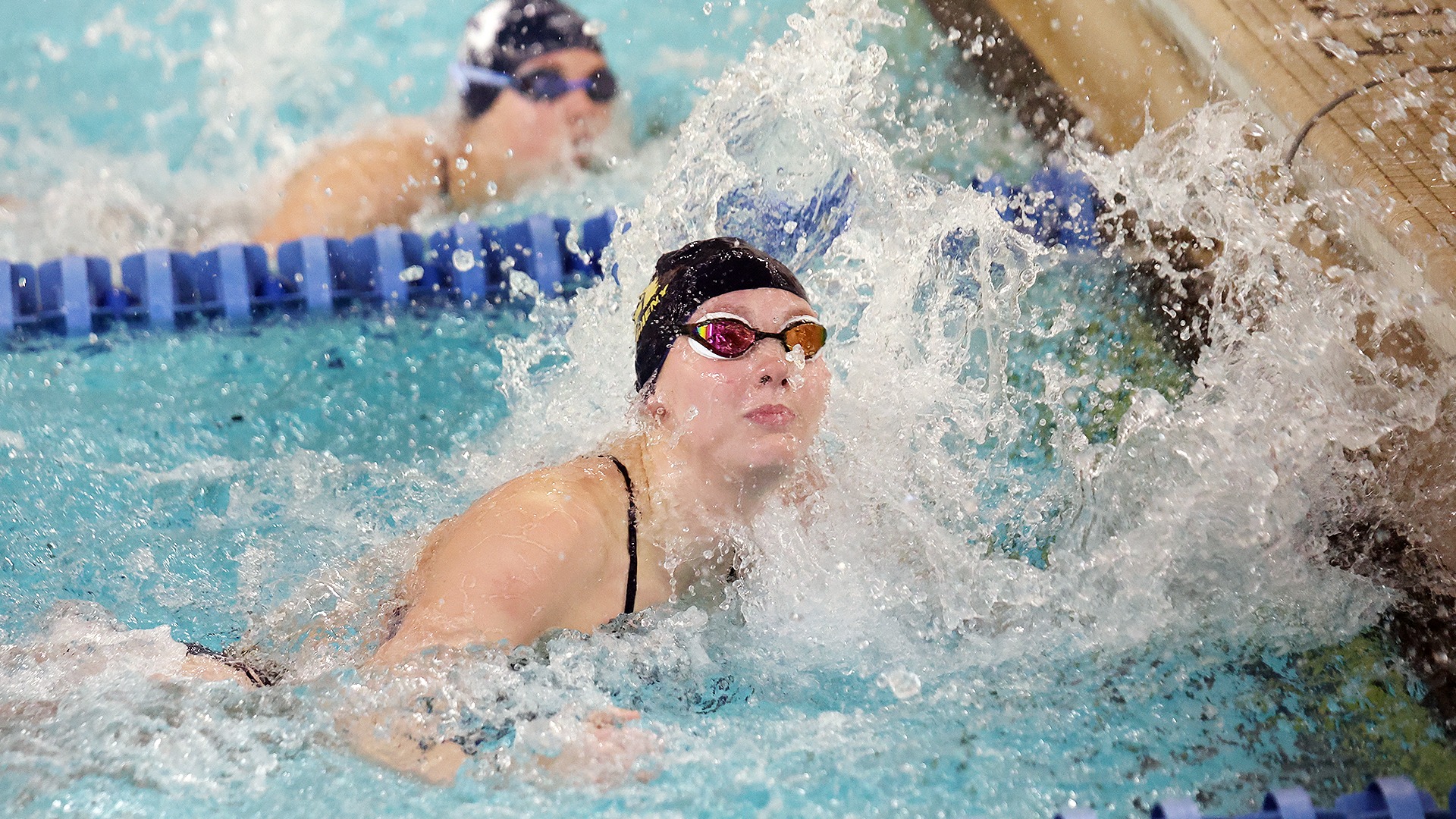 Women's Swimming in action against Westminster.