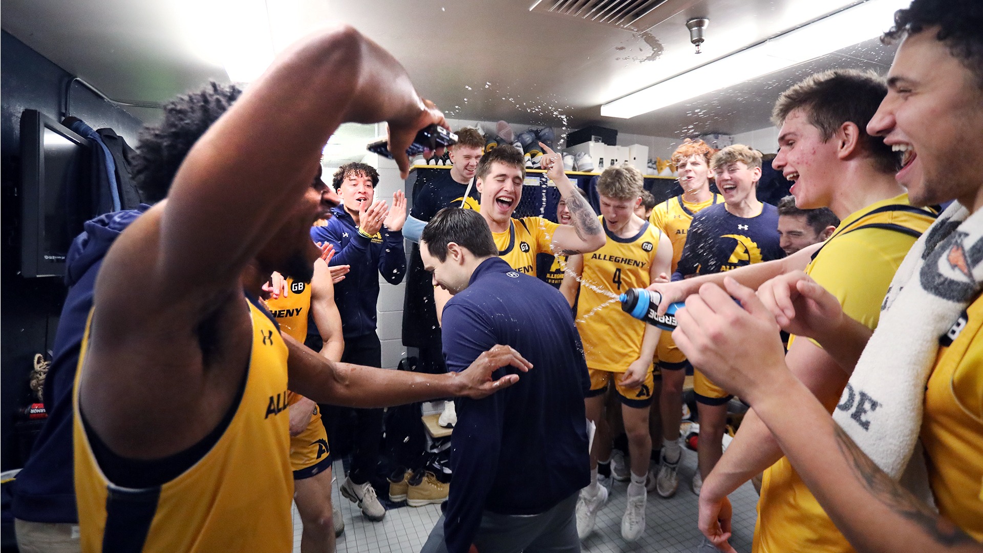 Men's basketball celebrates 66-54 win vs. Westminster in PAC opener, Dec. 3, 2025. Photo by Ed Mailliard.