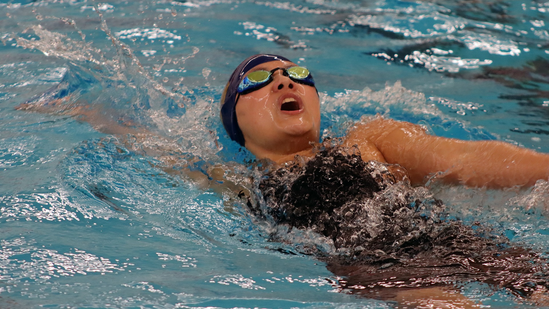 Magnolia Myers competes in the 200 backstroke at the PAC Championships