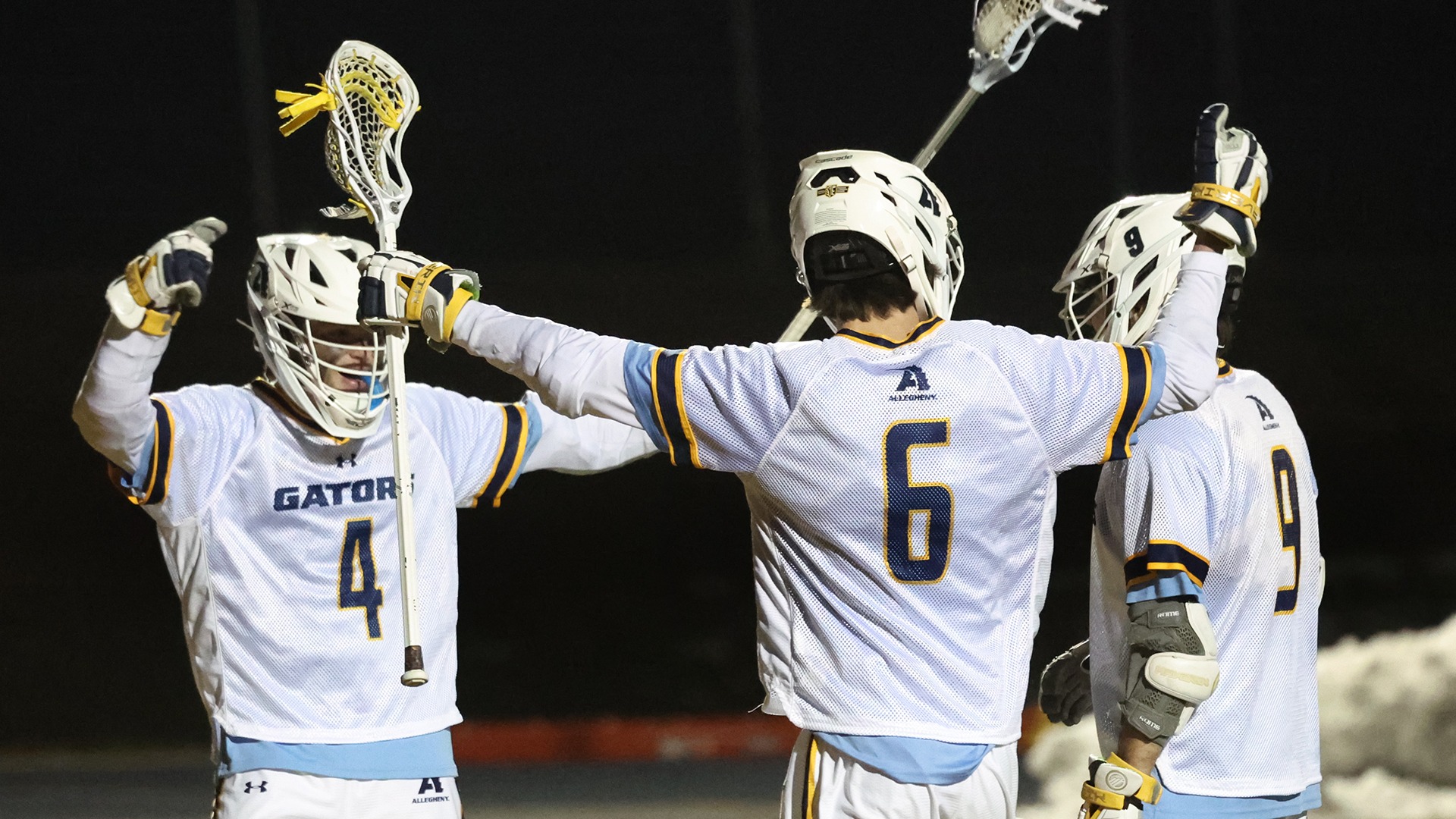 Men's lacrosse celebrates during 13-3 win vs. Pitt-Bradford, Feb. 25, 2026. Photo by Ed Mailliard.