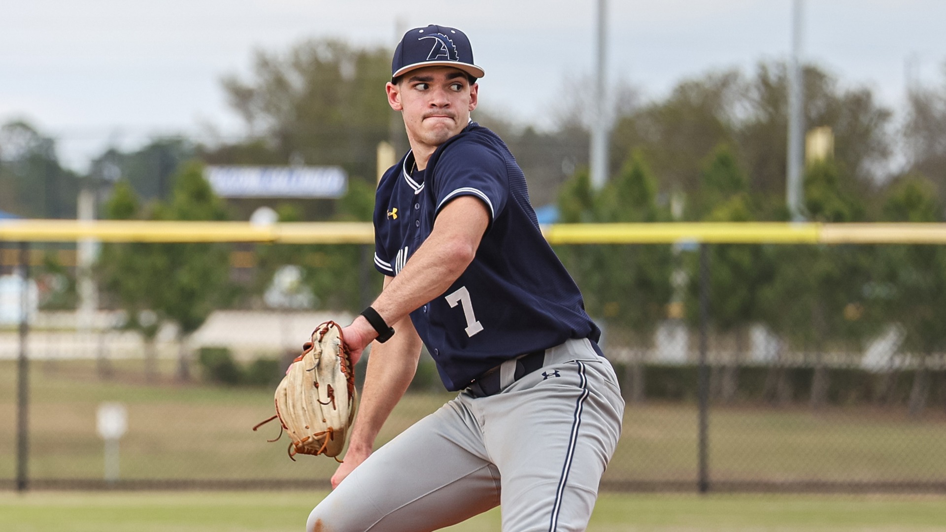 Zach Miner pitching vs. St. John Fisher, Feb. 28, 2026. Photo by Sheri Skaggs.