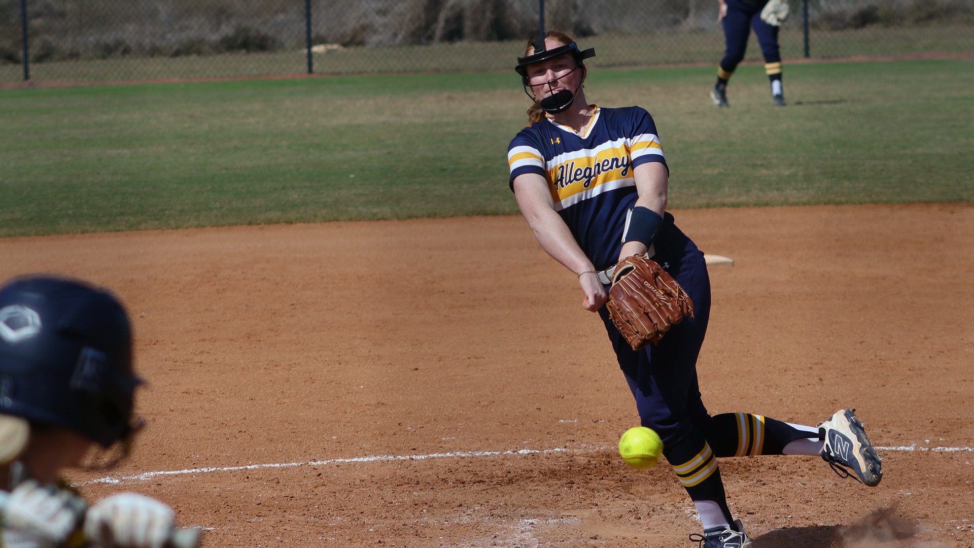 Madison Hulse pitching against Simmons