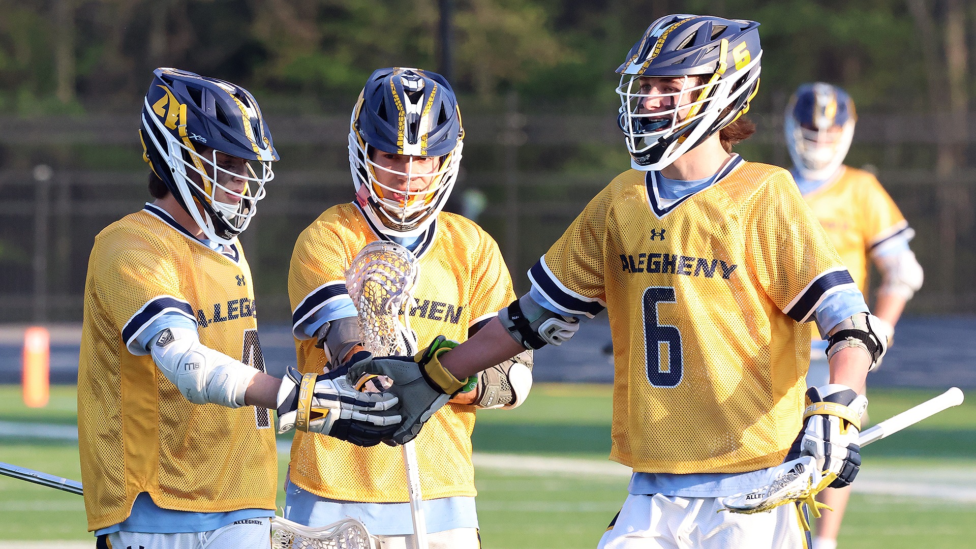 Allegheny men's lacrosse celebrates a goal against Westminster.