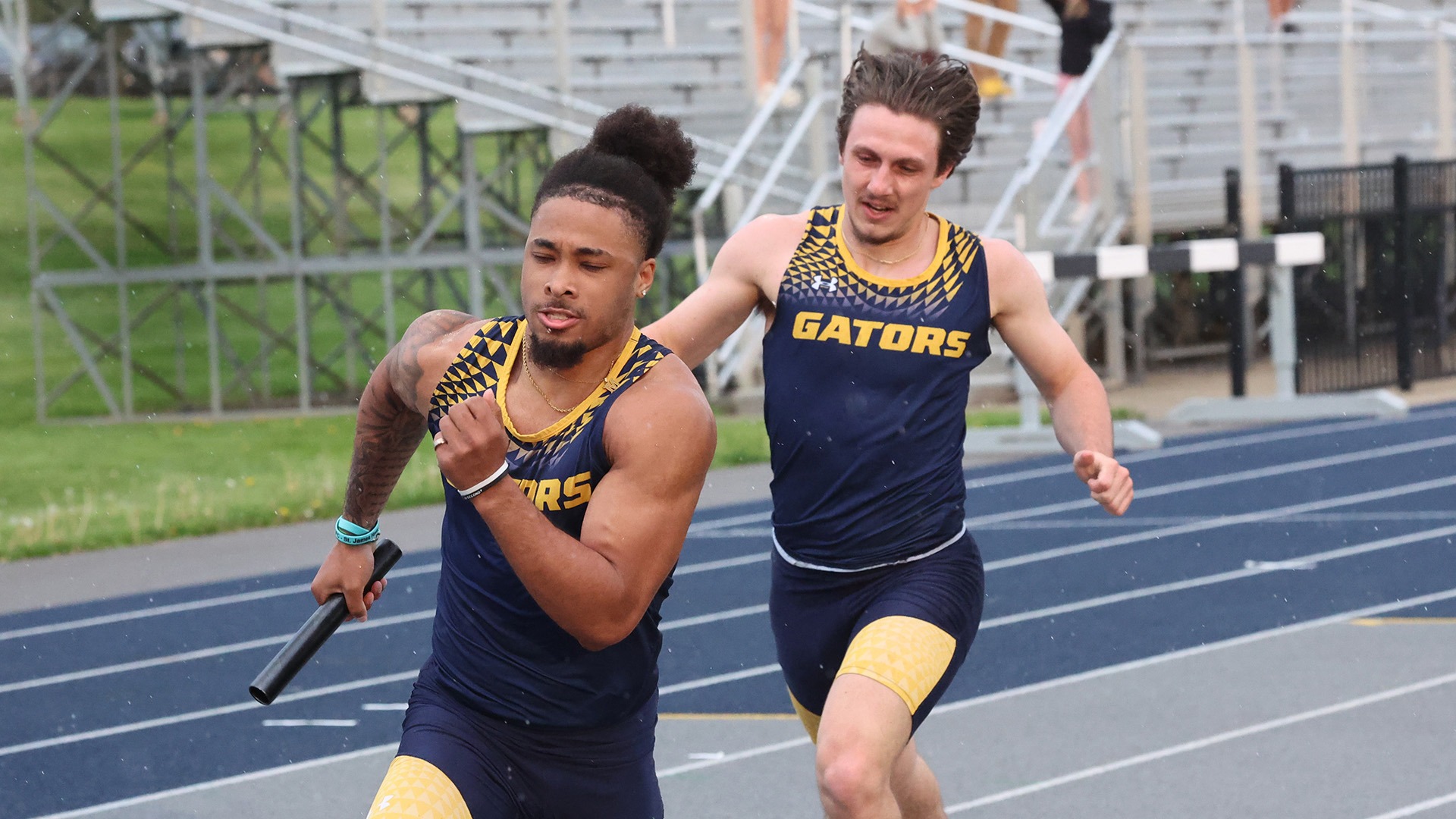 Sha'Mar Nguyen (L) and Carter Betz (R) in a relay race at the 2026 Marty Goldberg Gator Invitational, April 24, 2026. Photo by Ed Mailliard.