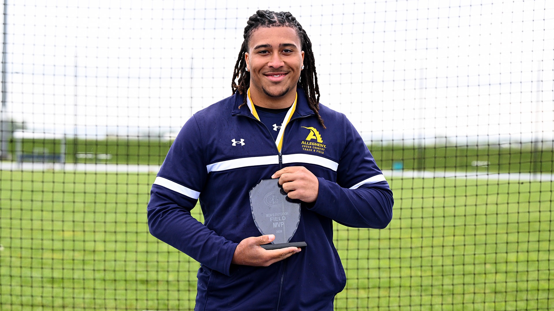 Andre Anderson with Field MVP trophy at 2026 PAC Outdoor Championships, May 1, 2026. Photo by Robert Hayes.