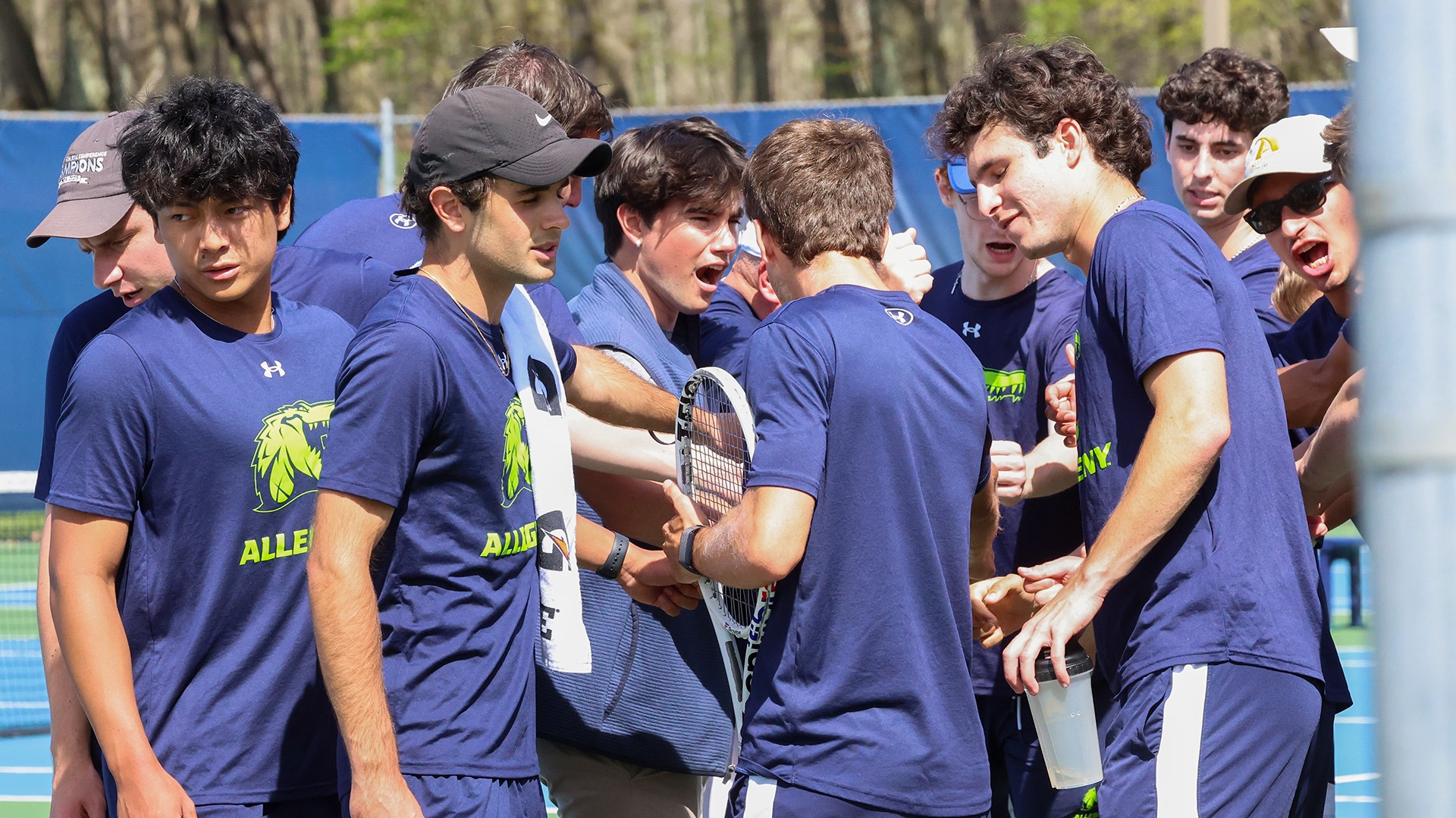 Men's tennis team huddle vs. Grove City in PAC championship, April 27, 2026. Photo by Ed Mailliard.