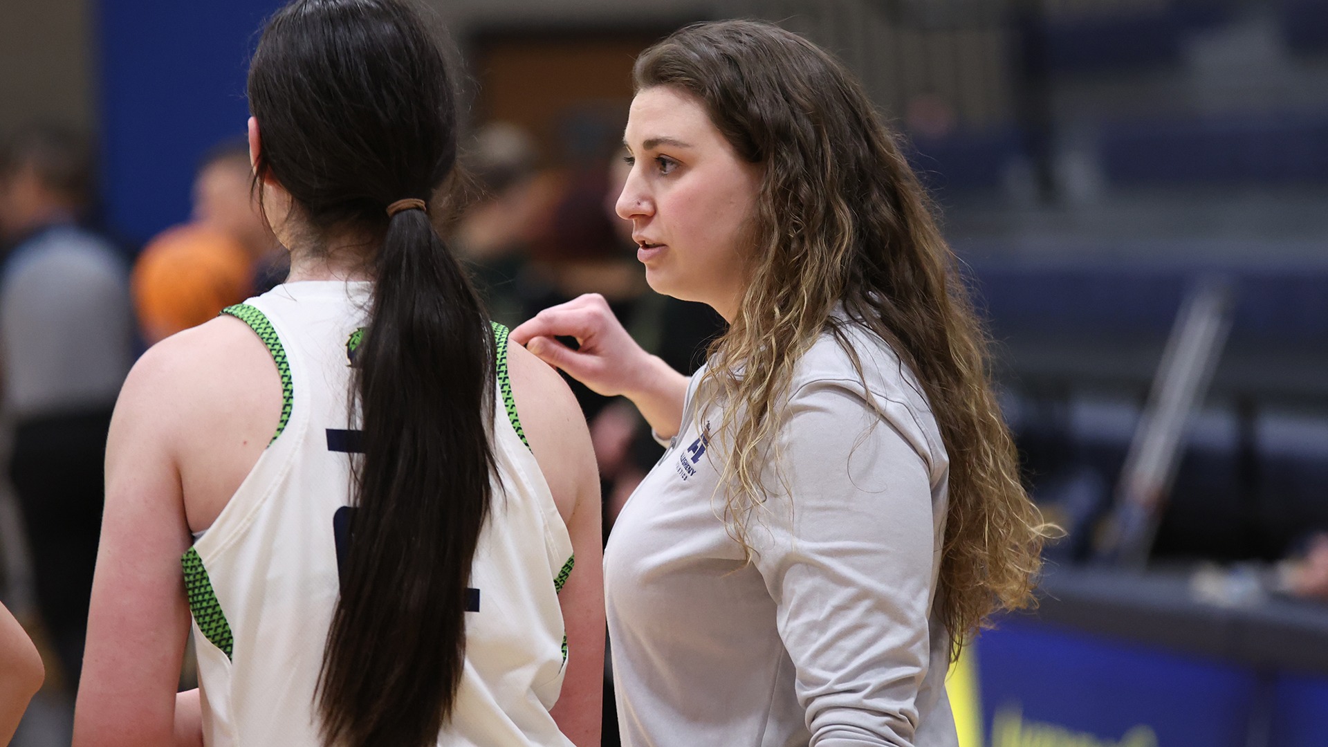 Coach Davis talks to her team during a timeout.