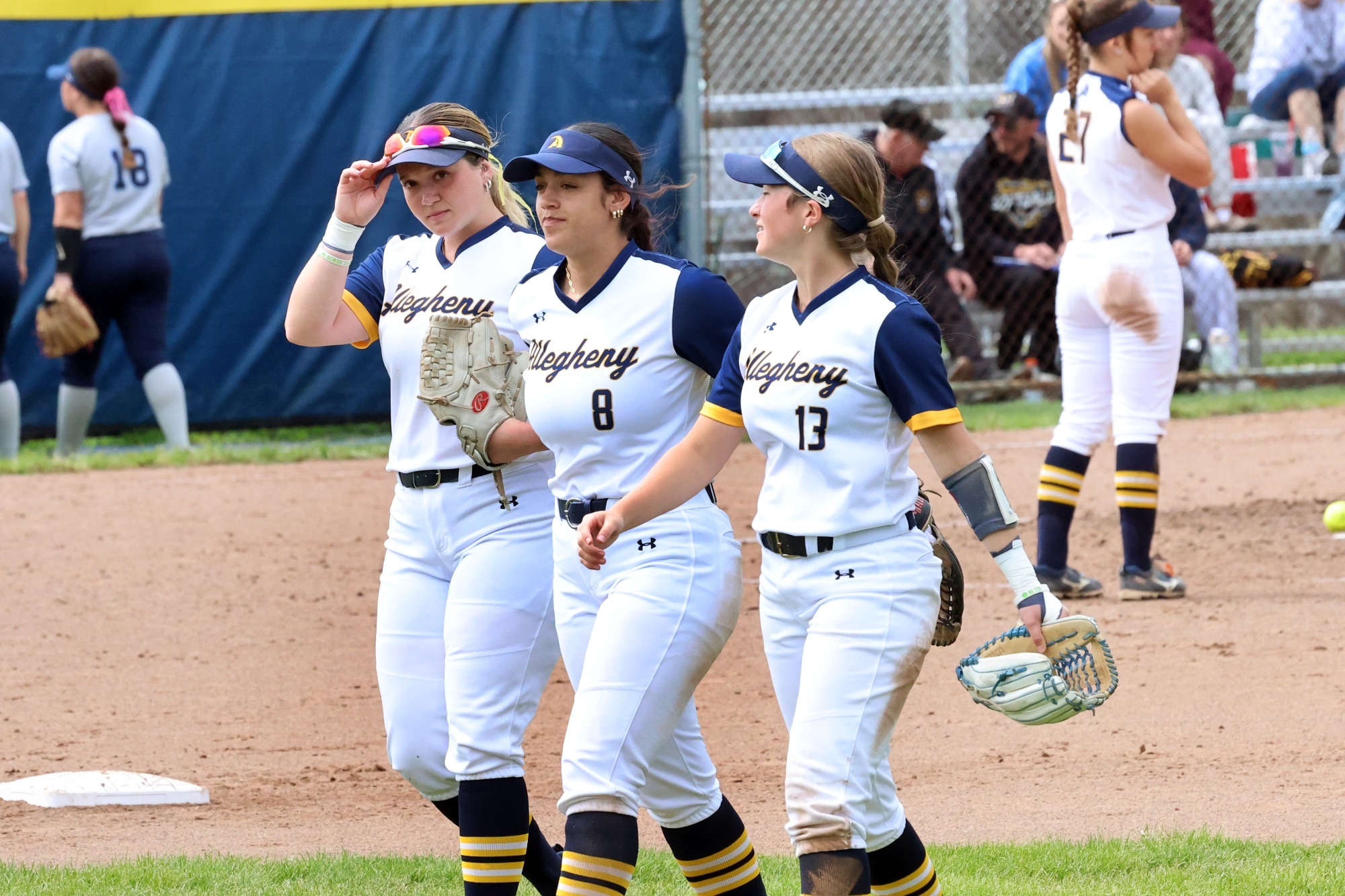 Samantha Phillips (L), Jayla Jones (M) and Abby Robinson (R) take the field