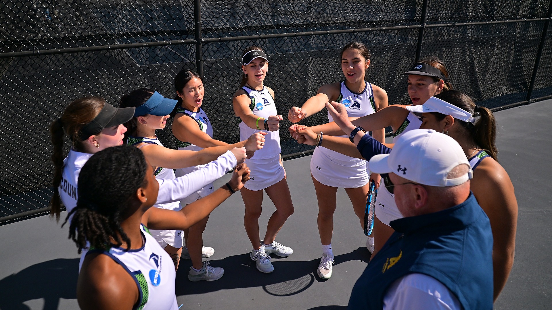 Allegheny women's tennis team huddle vs. RPI, May 8, 2026. Photo by Ryan Murray/davidsinclairphoto.com