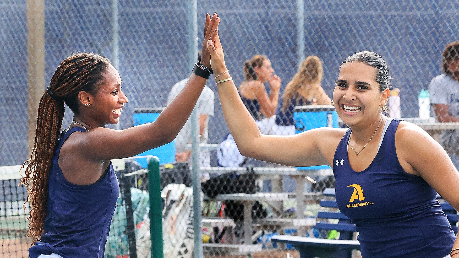 Evie Ellenberger (L) and Adriana Navarro (R) celebrate their doubles win vs. Geneva, Sept. 16, 2026. Photo by Ed Mailliard.